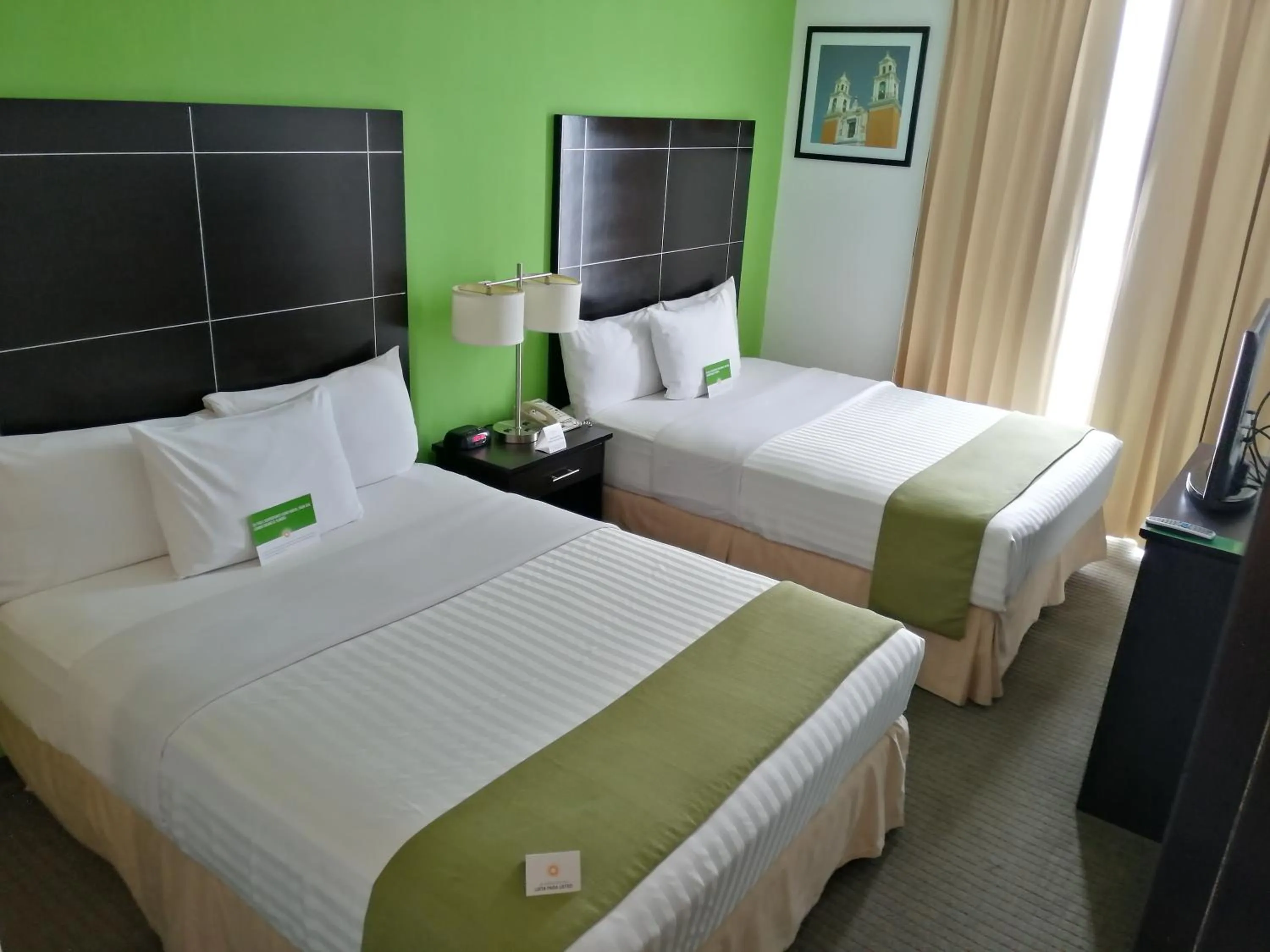 Photo of the whole room, Bed in La Quinta by Wyndham Puebla Palmas Angelopolis