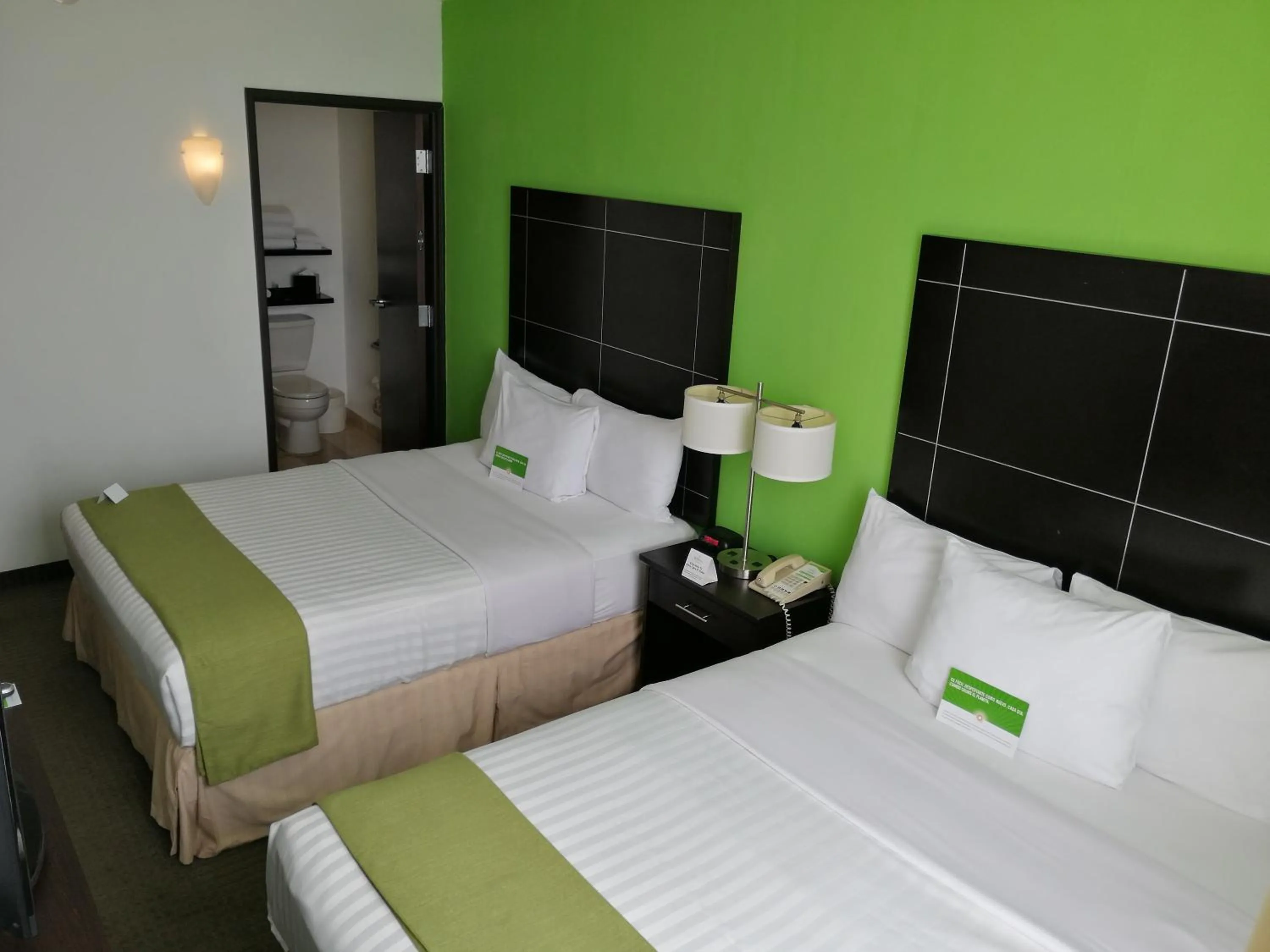 Photo of the whole room, Bed in La Quinta by Wyndham Puebla Palmas Angelopolis