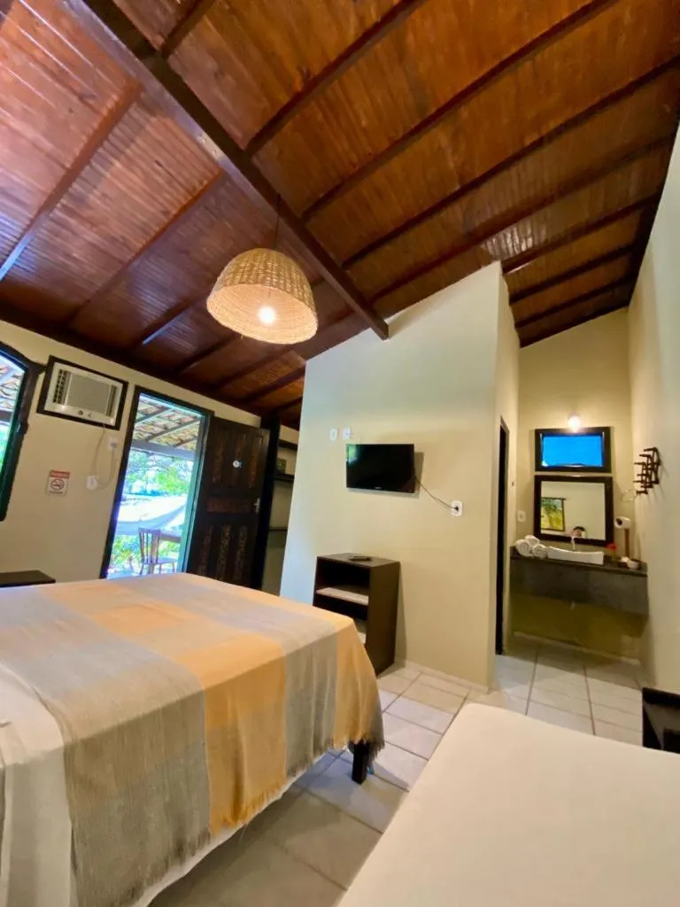 Bed in Pousada Tubarão