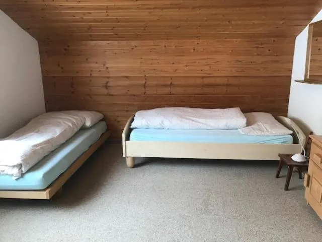 Bed in Hotel Alpina