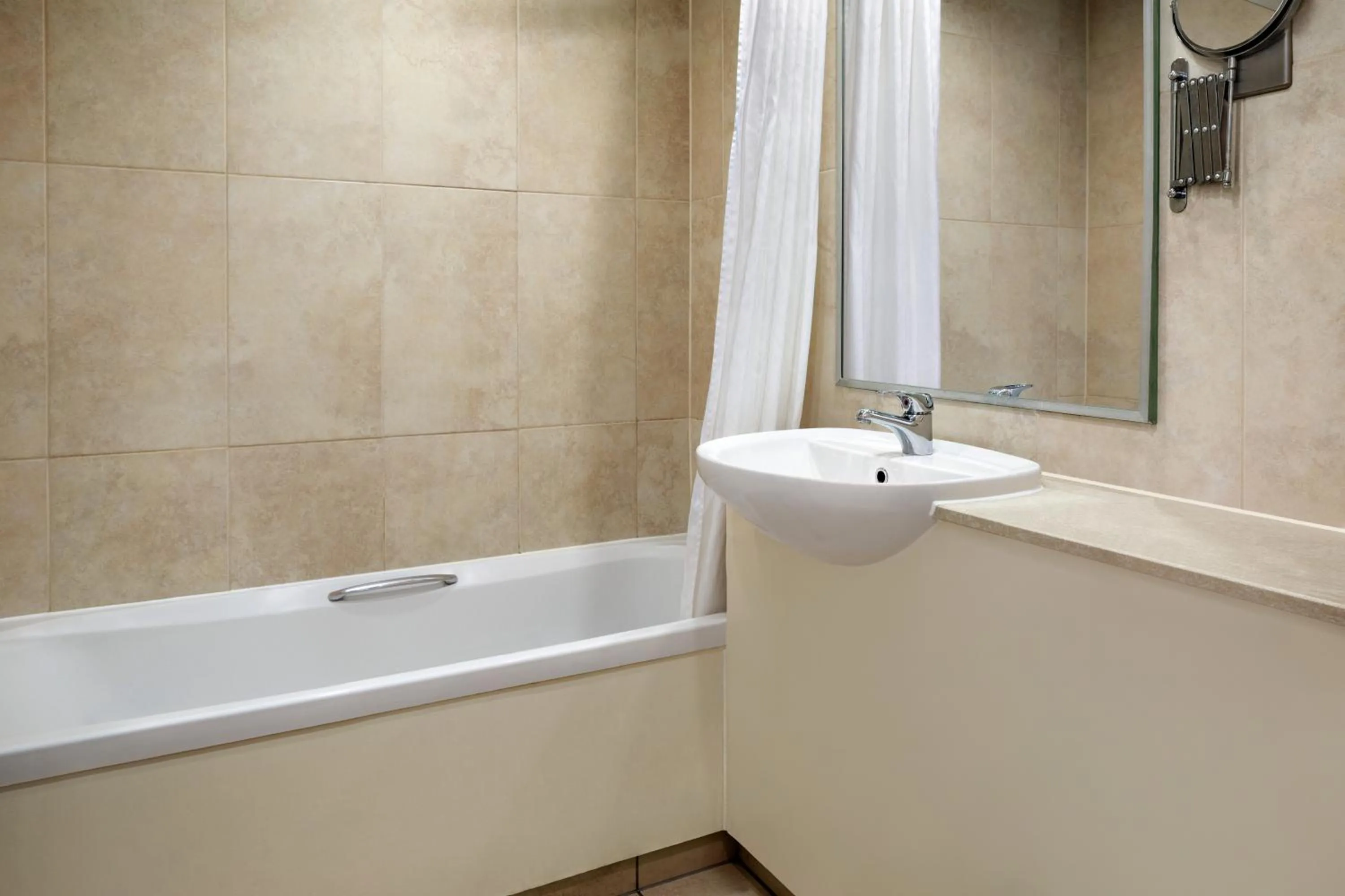 Bathroom in Ramada by Wyndham Cheltenham