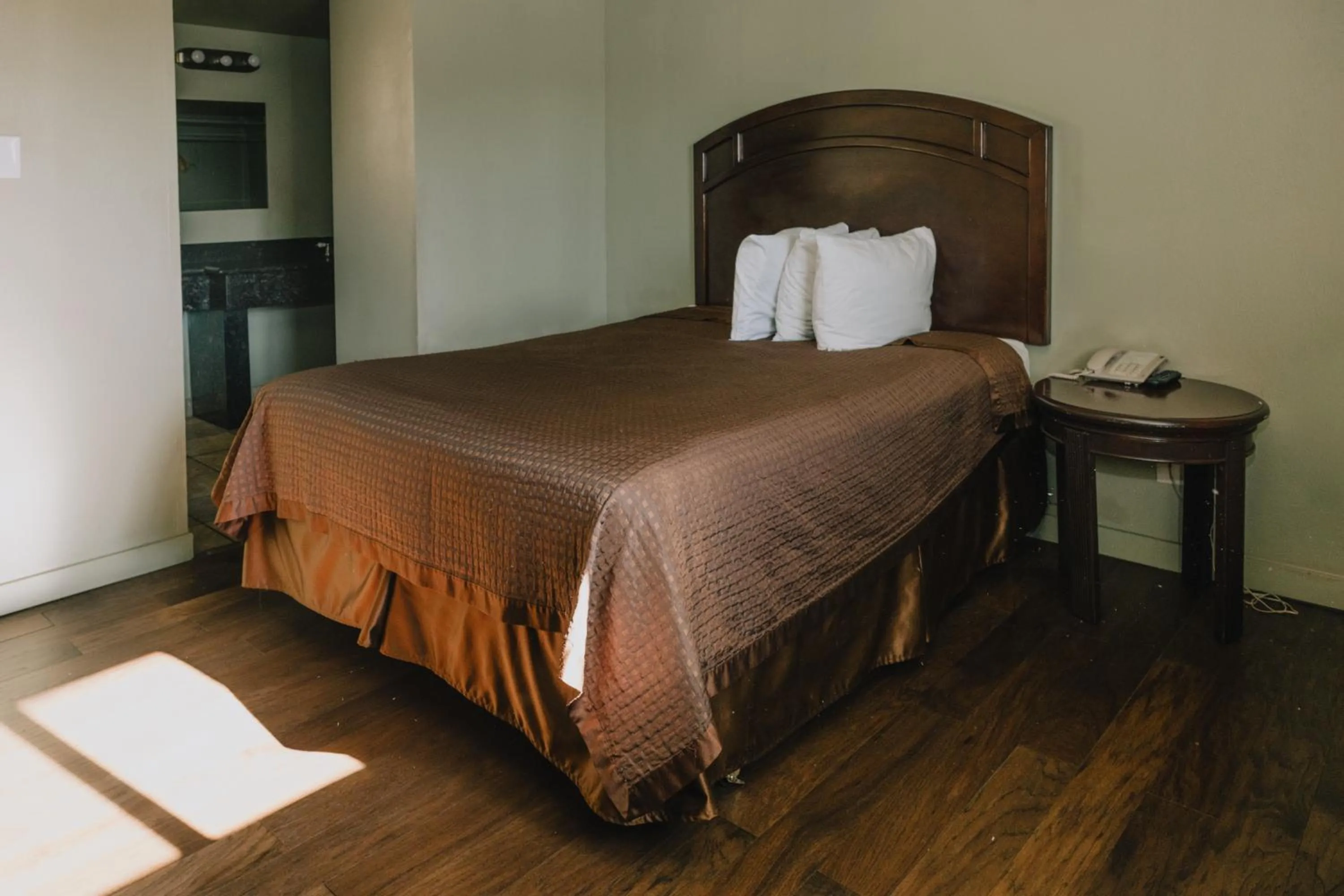 Bed in La Hacienda Motel