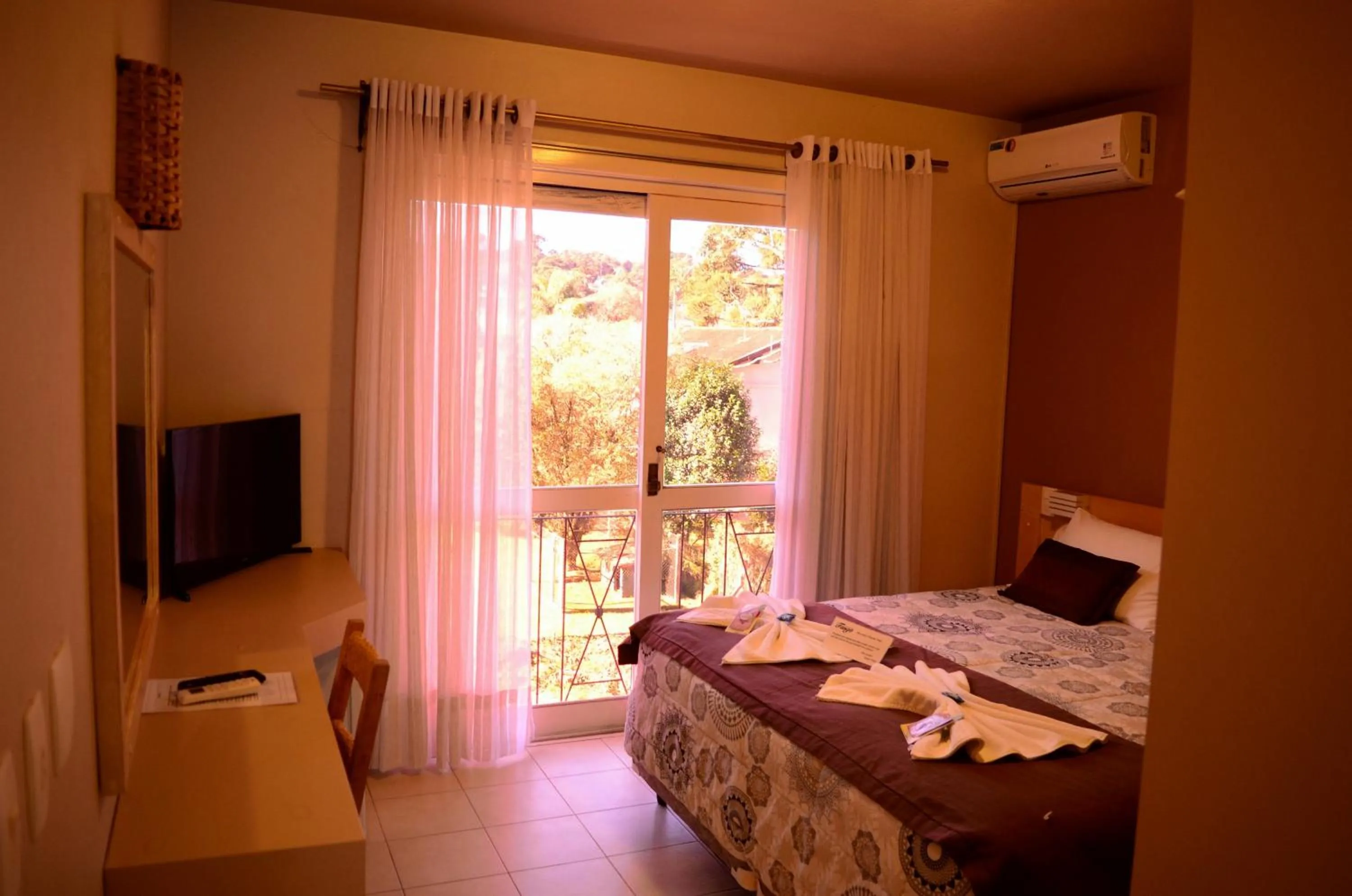 Bed in Pousada Tango