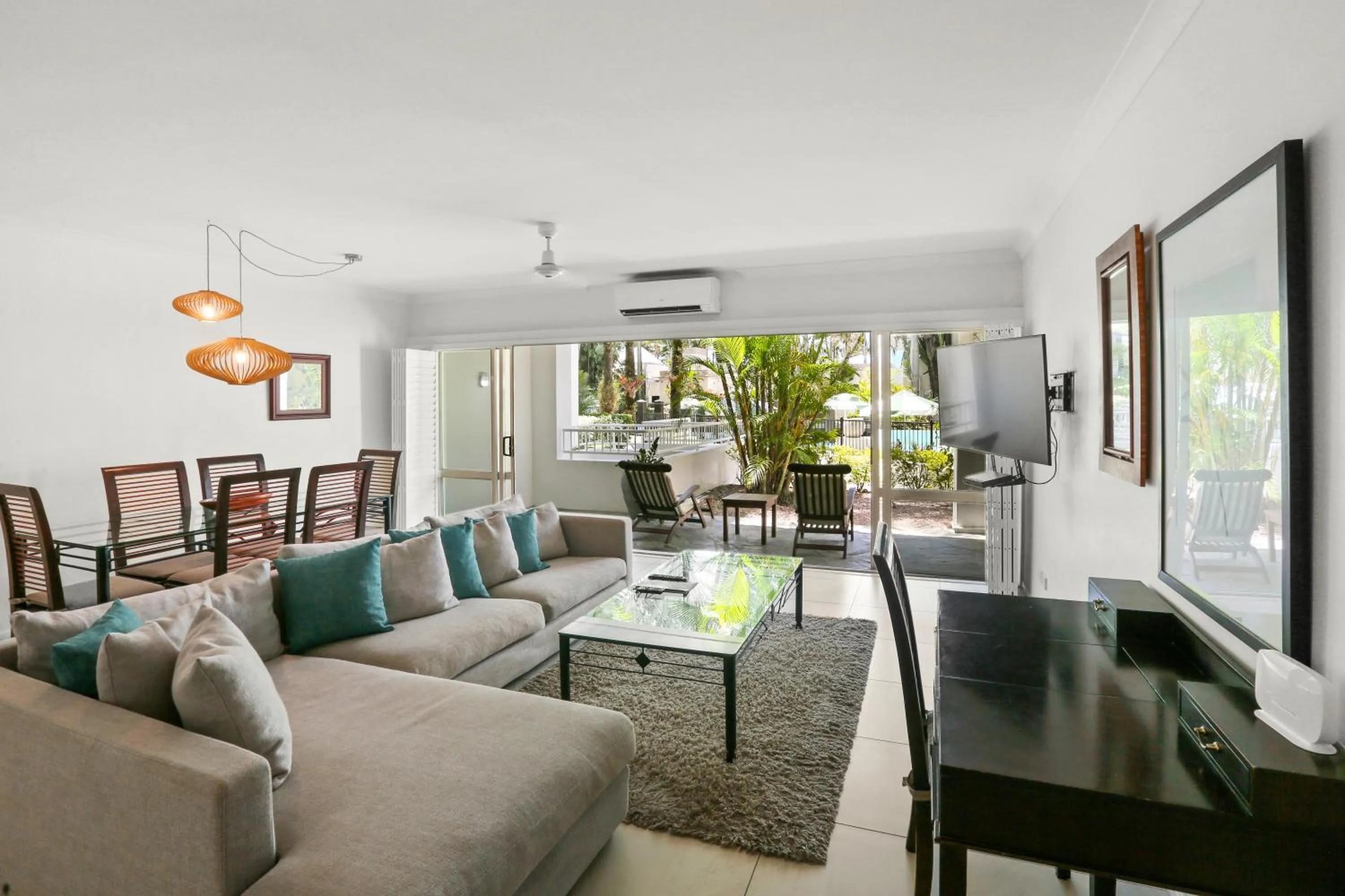 Living room in Alamanda Palm Cove by Lancemore