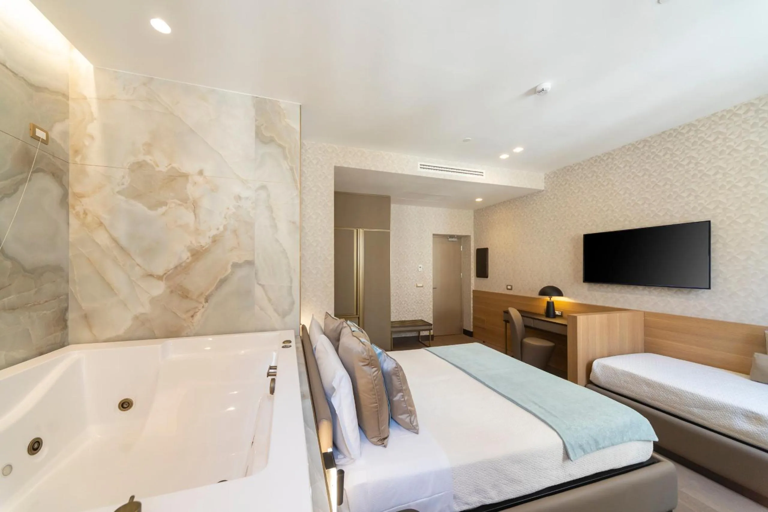 Bed in San Carlo Suite