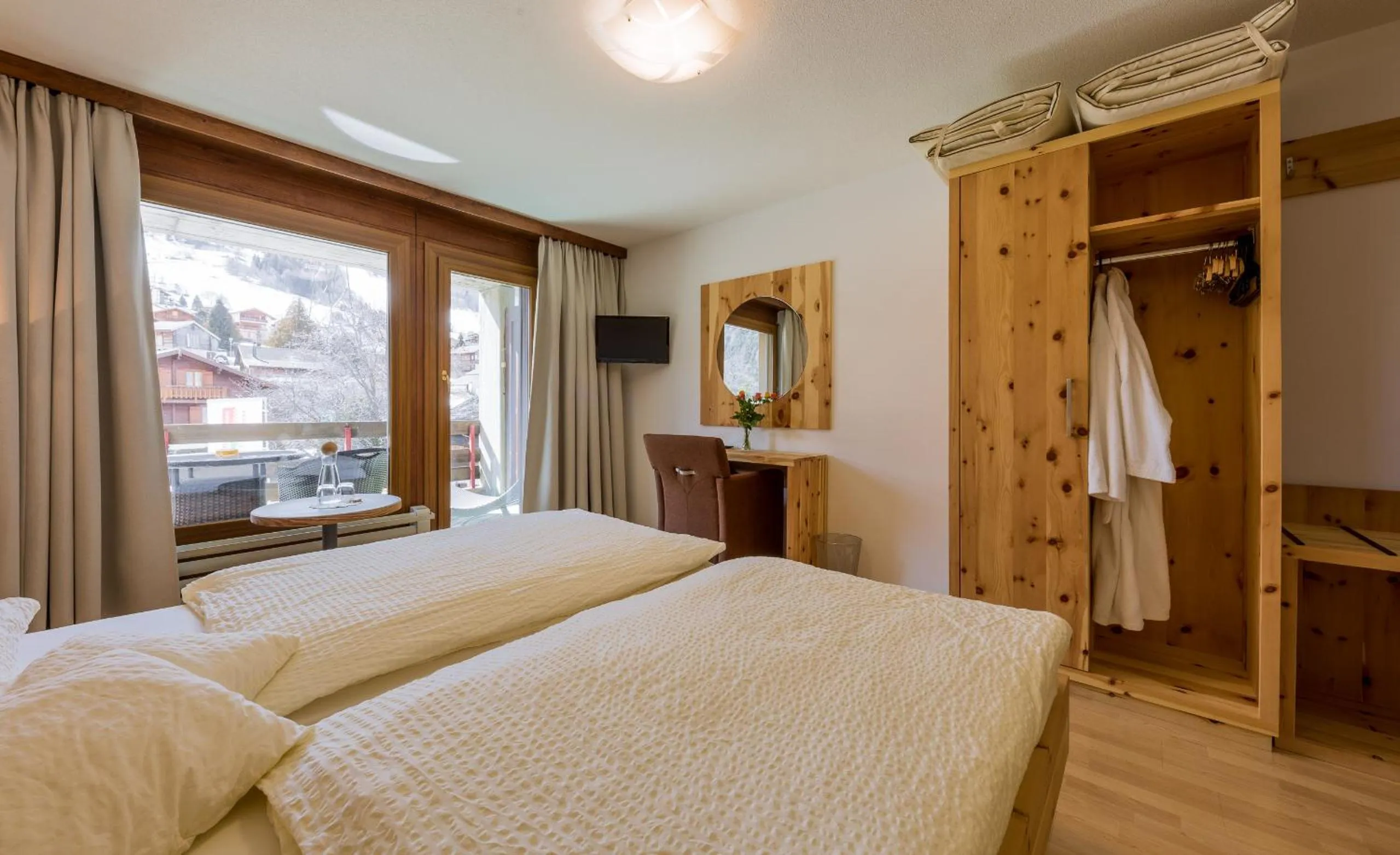 Photo of the whole room, Bed in Sporthotel Walliserhof