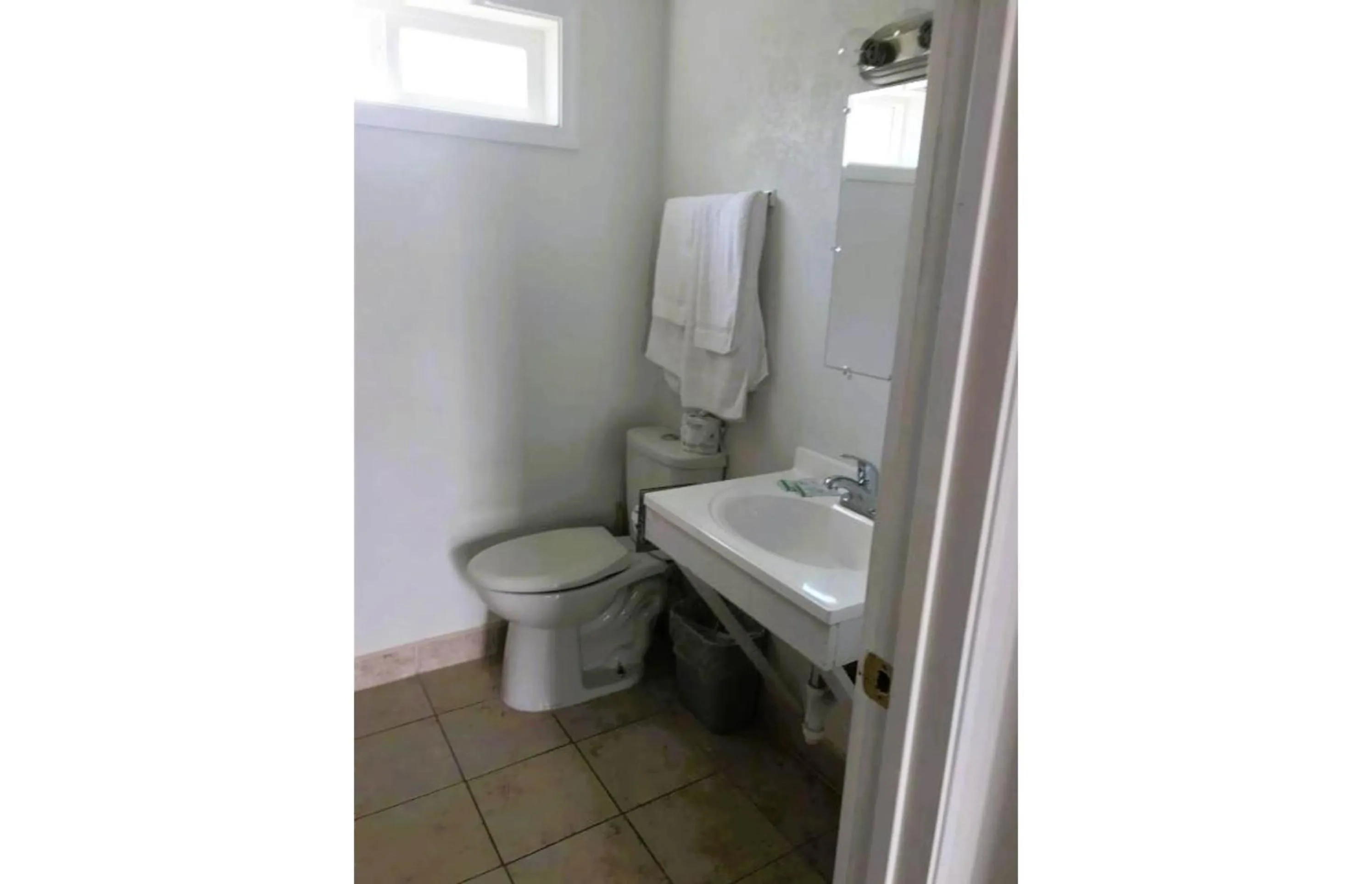 Bathroom in Royal Gateway Motel by OYO