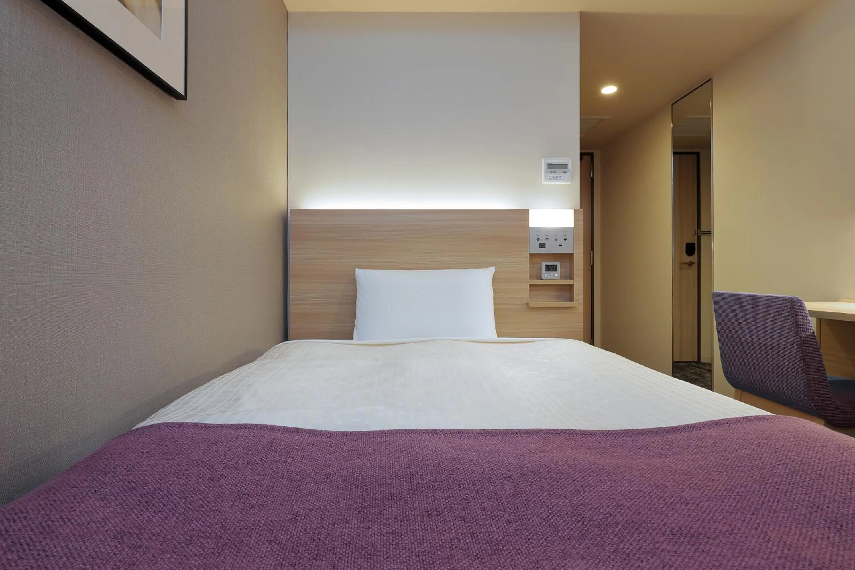 Bed in Keio Presso Inn Tokyo Kudanshita