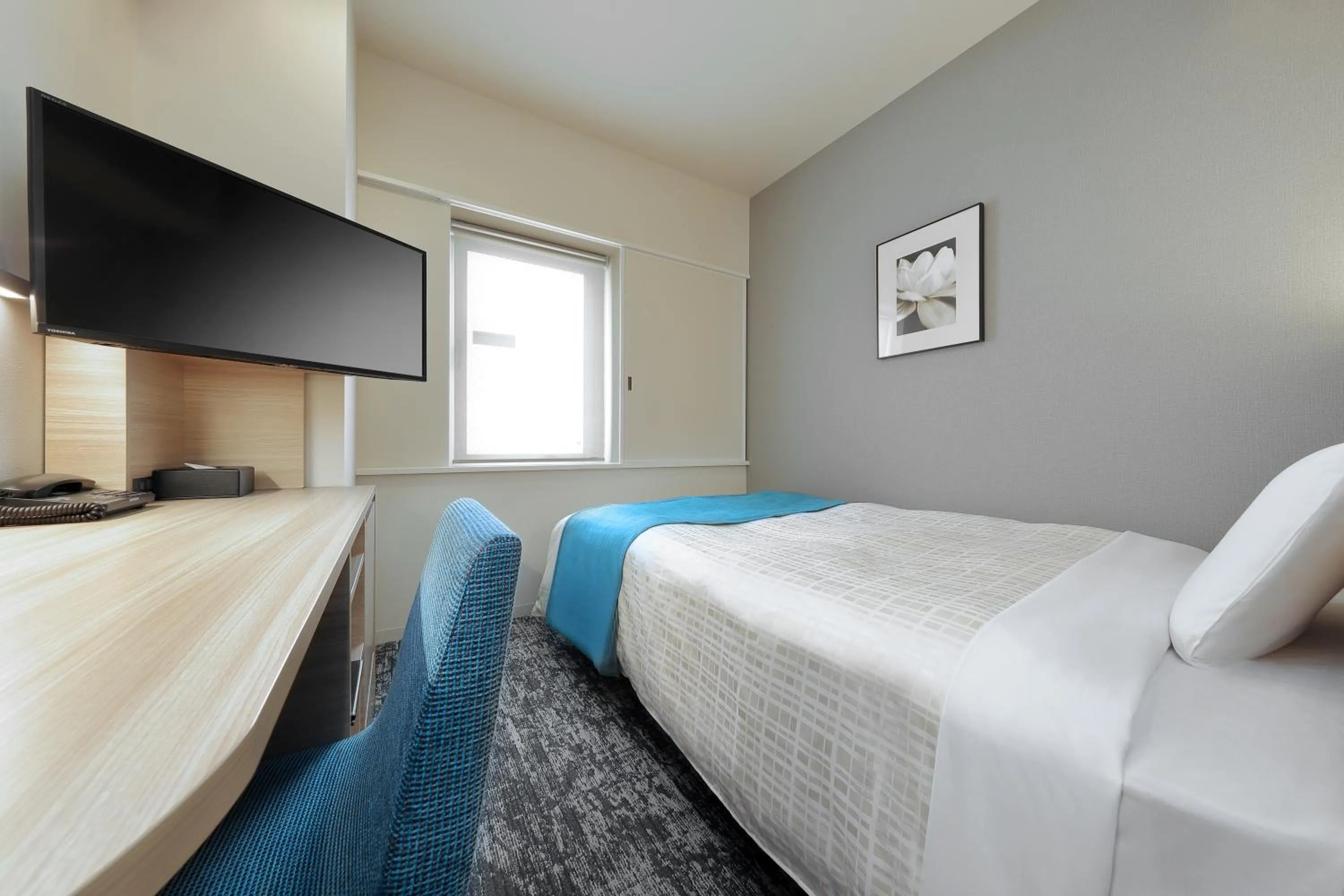 Bed in Keio Presso Inn Tokyo Kudanshita