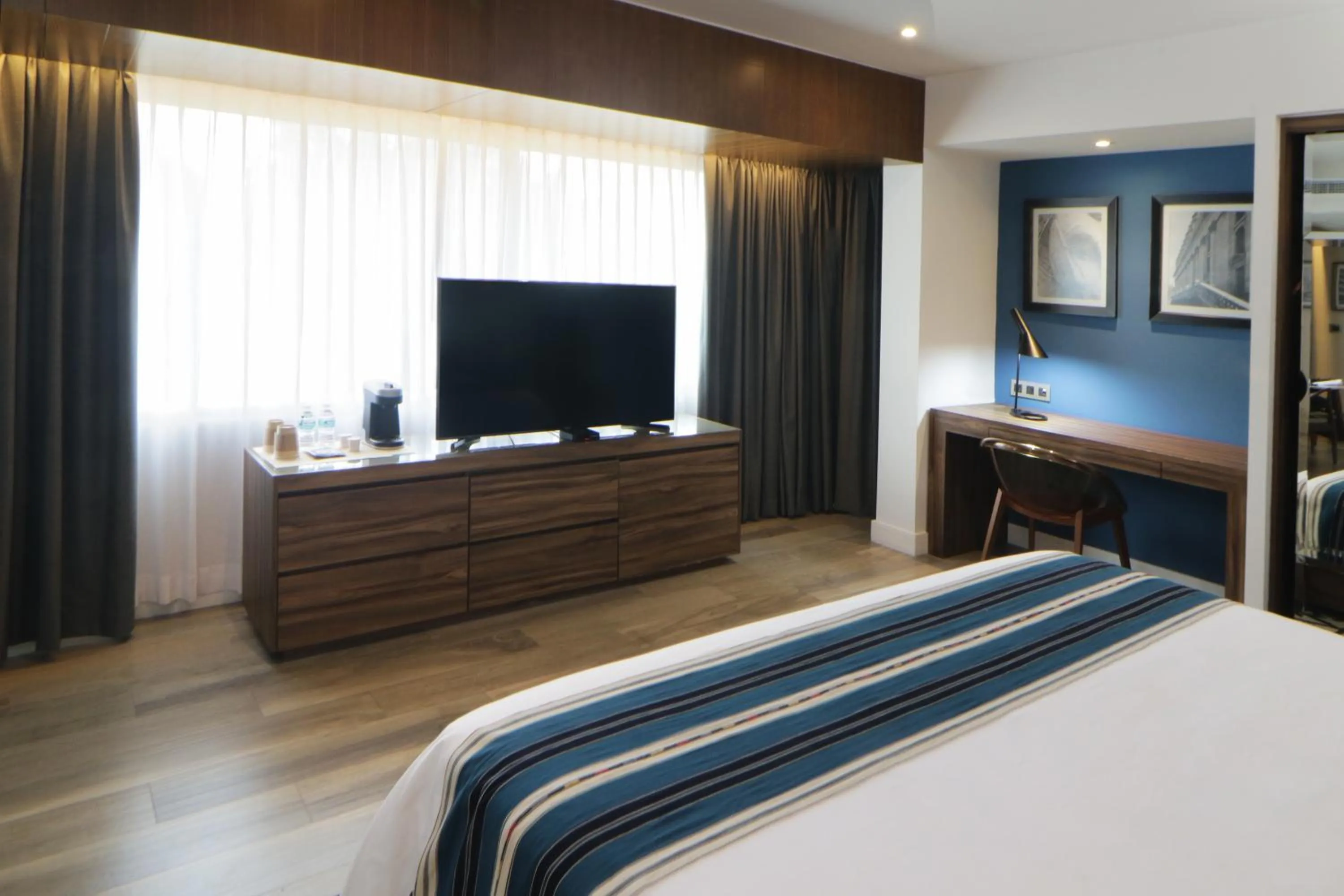 Bed in Hotel Indigo Guadalajara Expo by IHG