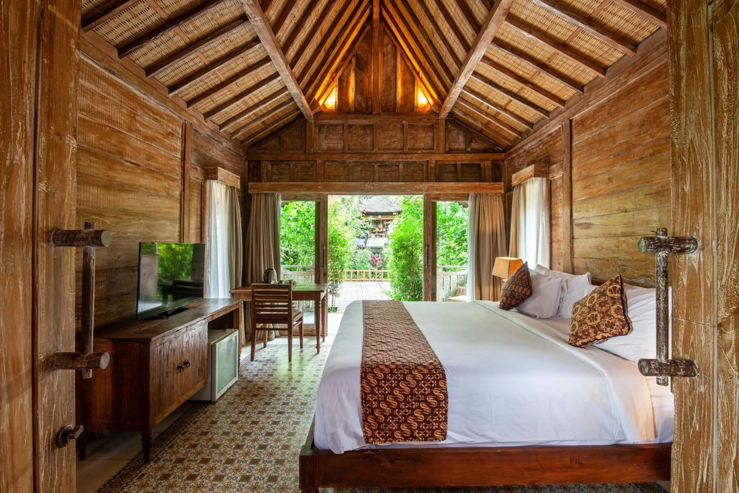 Bed in Outpost Ubud Bungalows