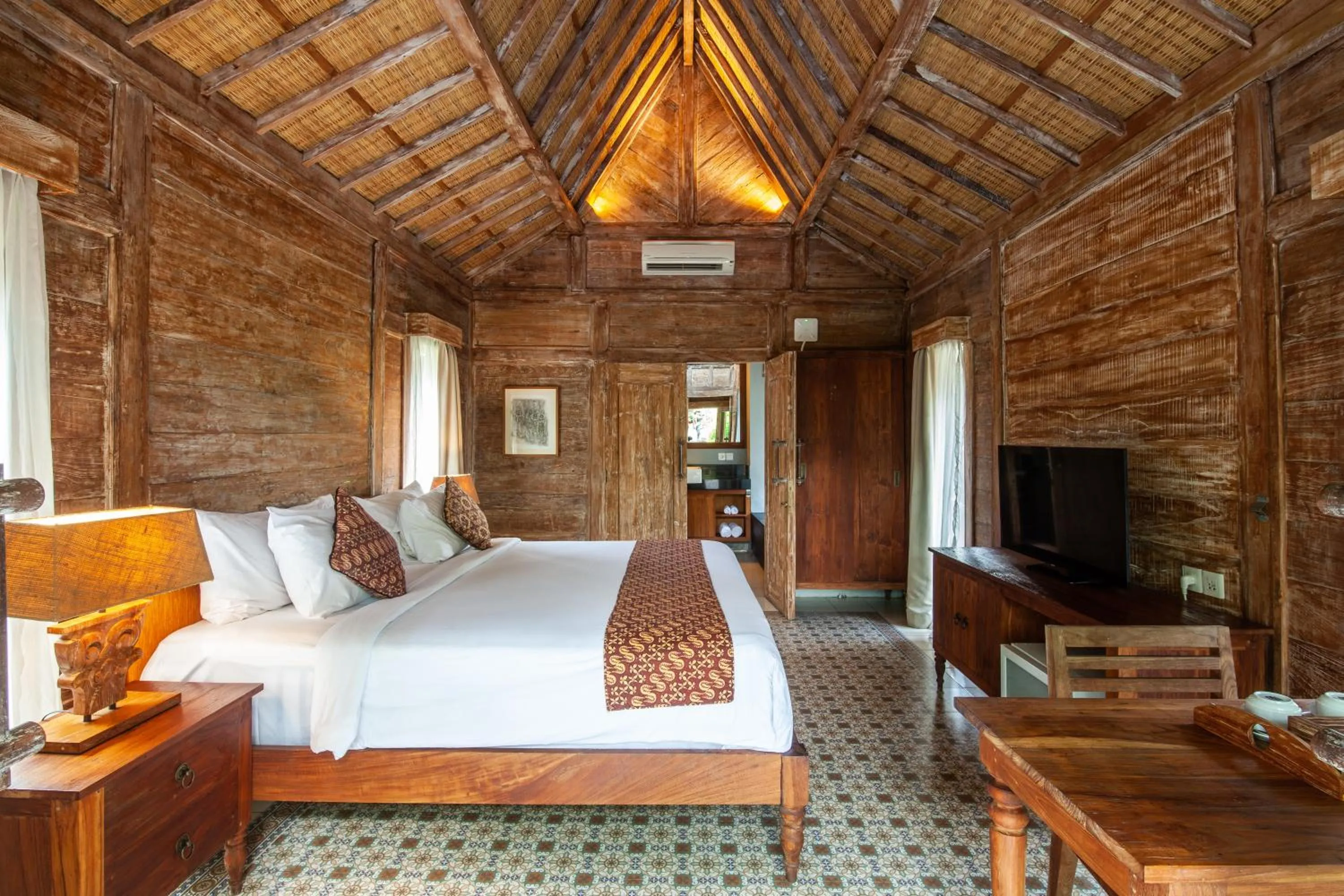 Bed in Outpost Ubud Bungalows