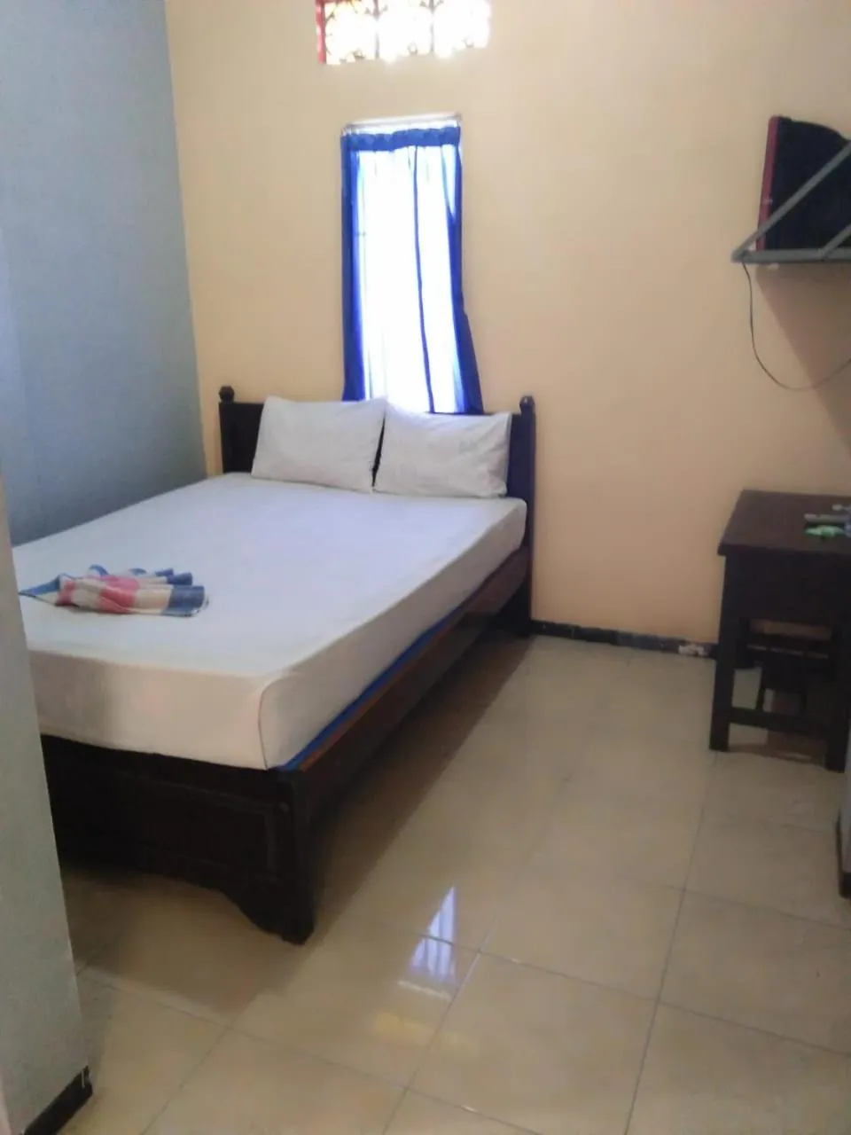 Bed in Penginapan Hotel Mangir Asri