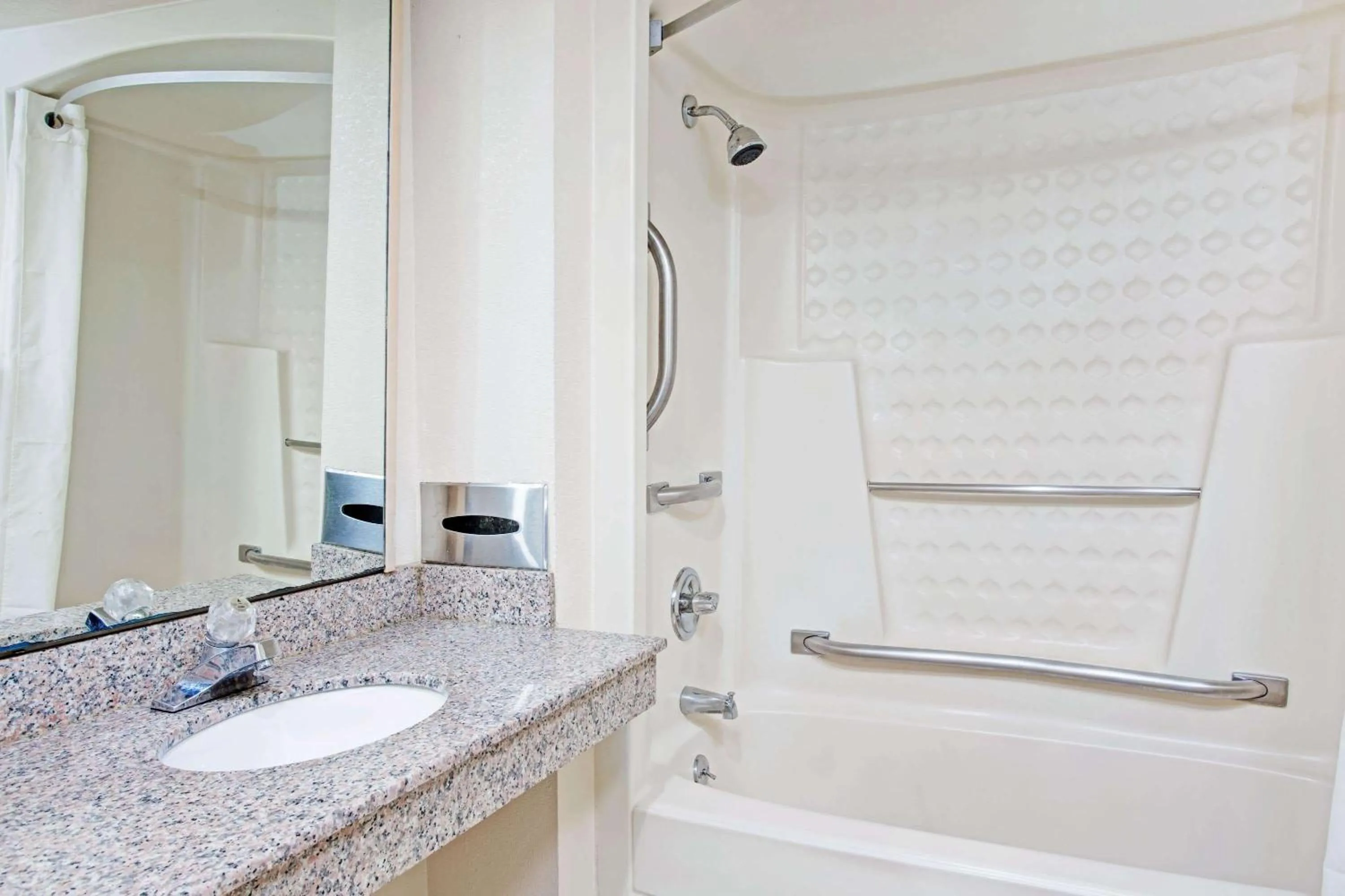 Bathroom in Super 8 by Wyndham Suwanee