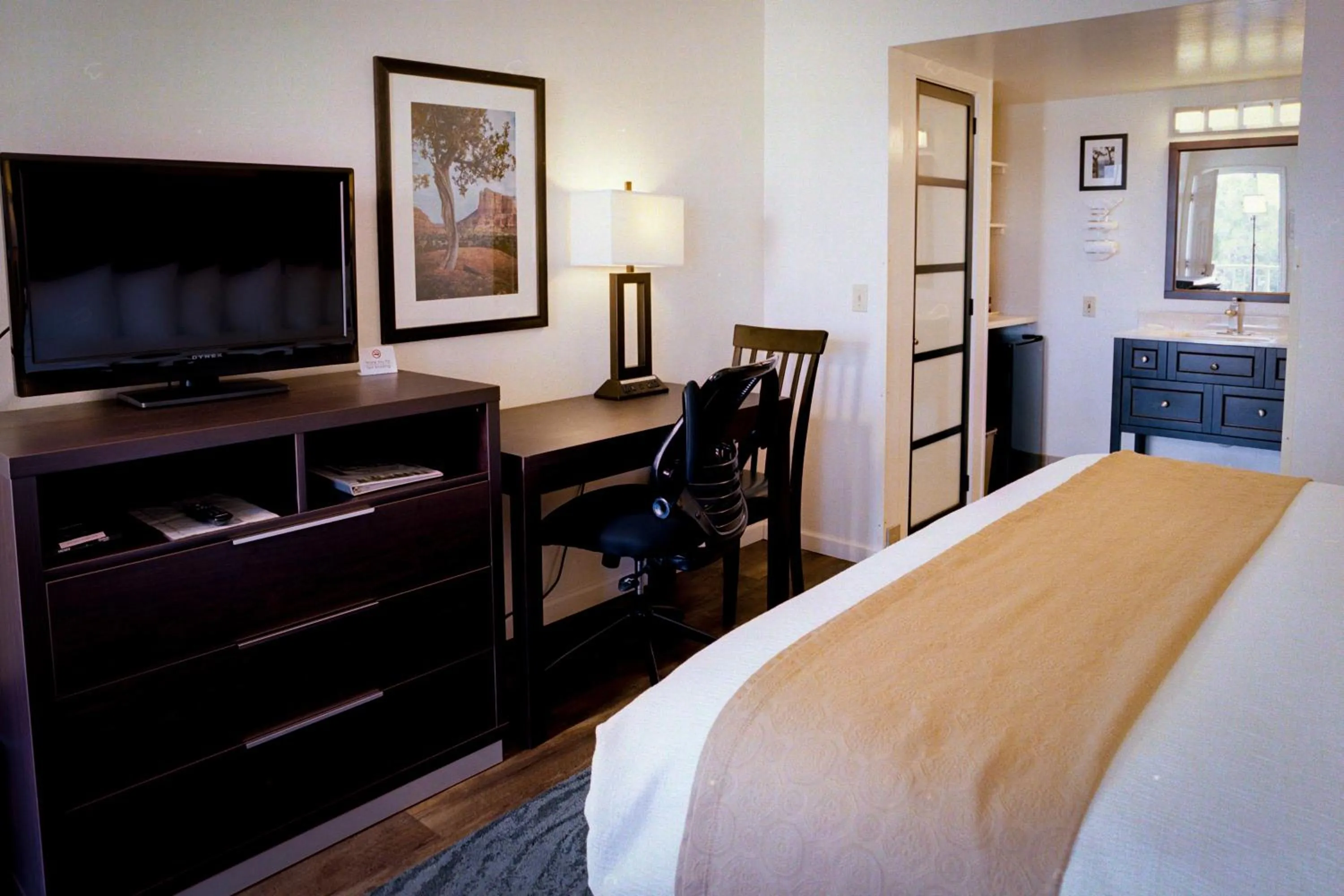 Bed in Pines Inn & Suites