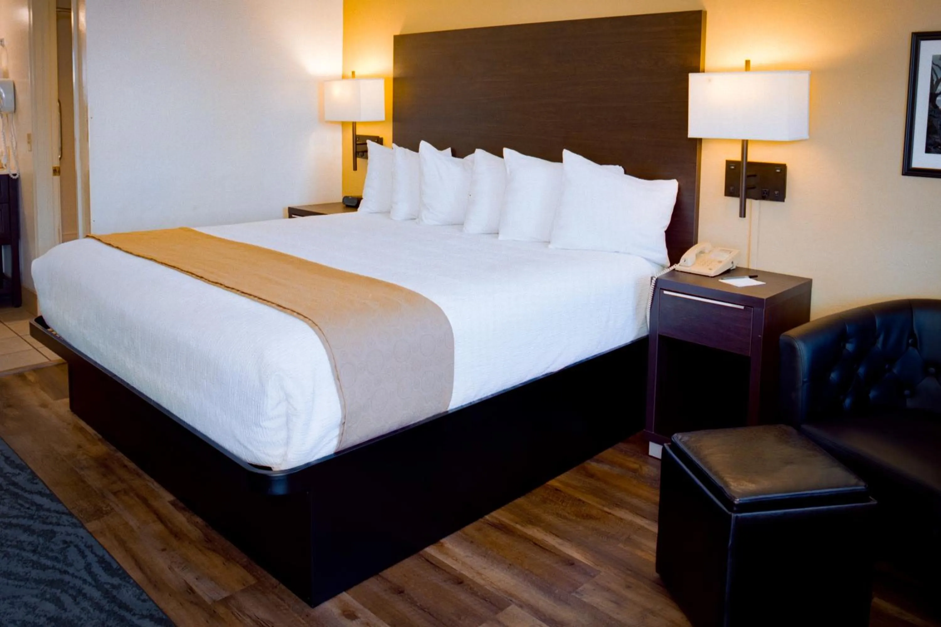 Bed in Pines Inn & Suites