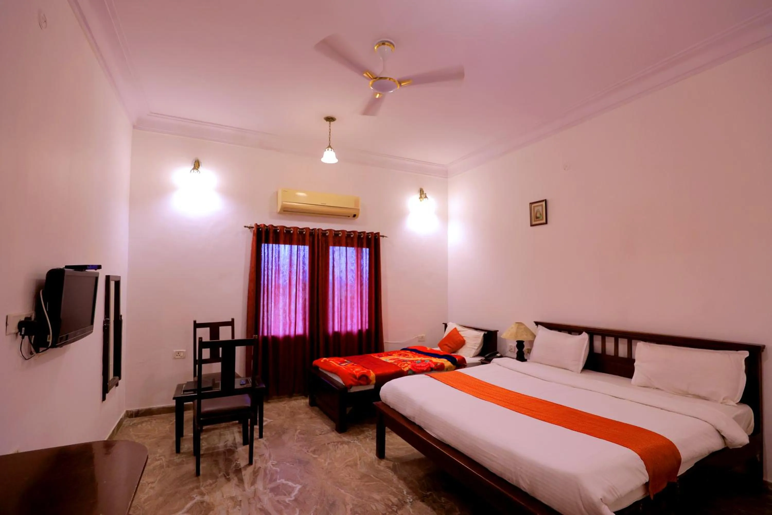 Bed in Satyam Palace Resort