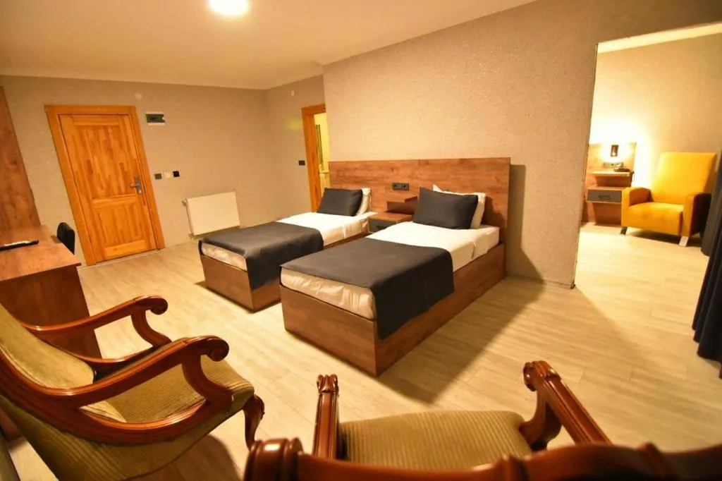 Bed in Green Palace Suite Hotel