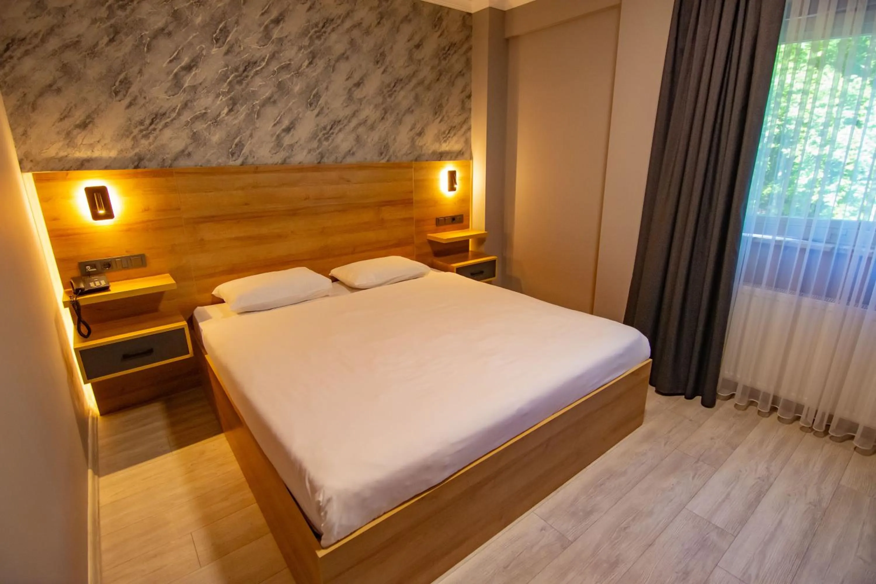 Bed in Green Palace Suite Hotel