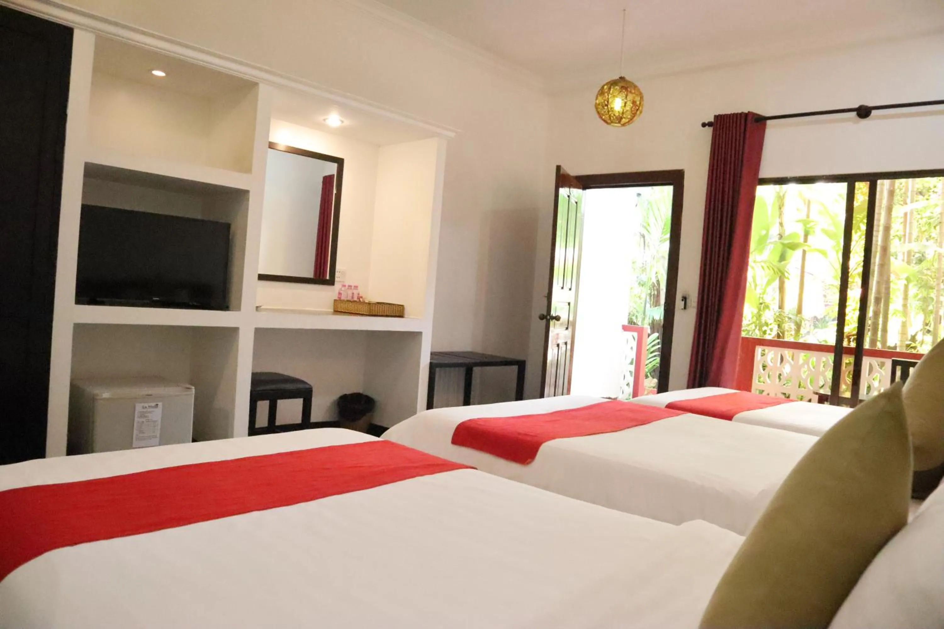 Bed in La Niche D'angkor Boutique Hotel