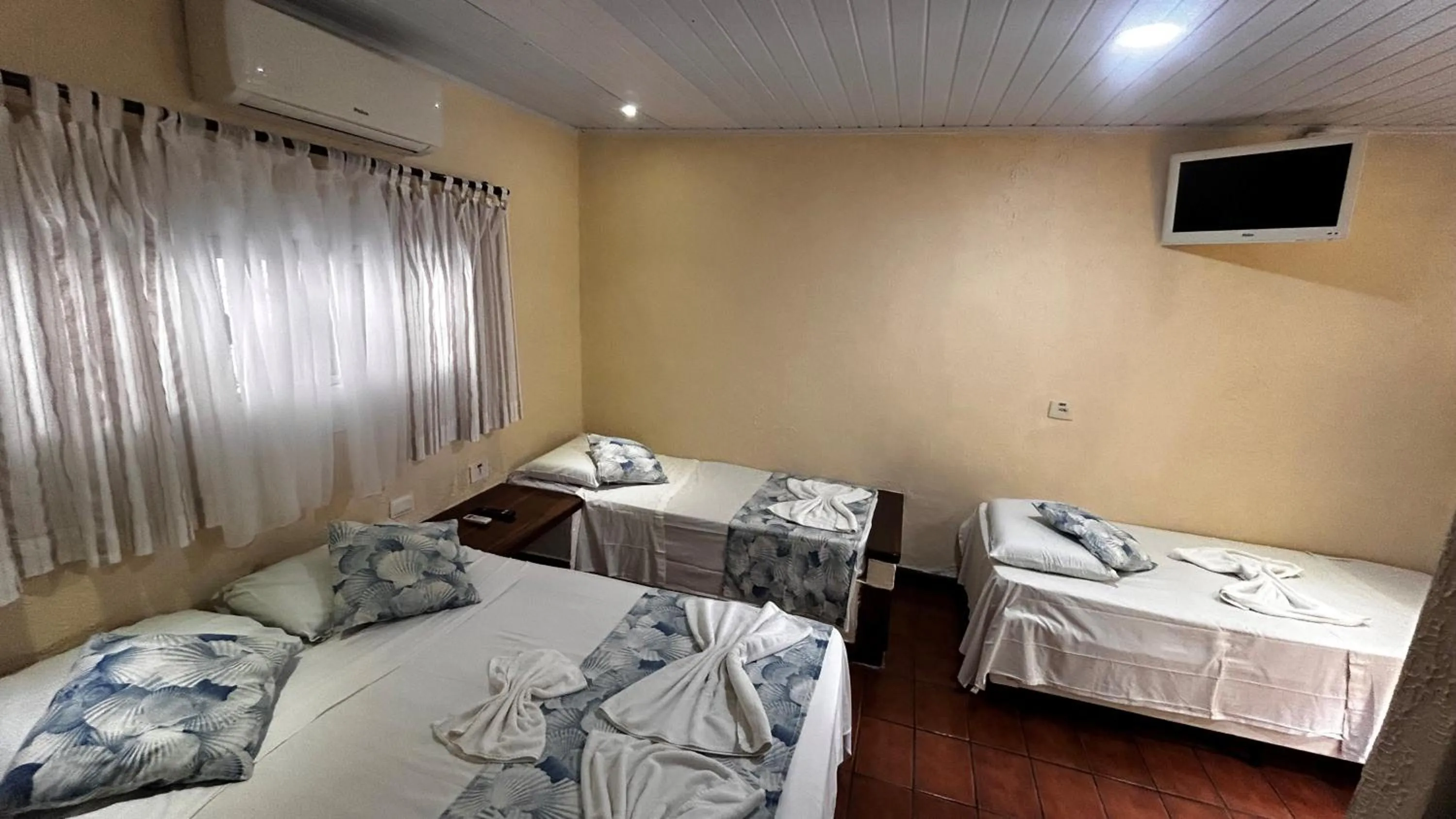 Bed in Pousada Aporan Ilhabela