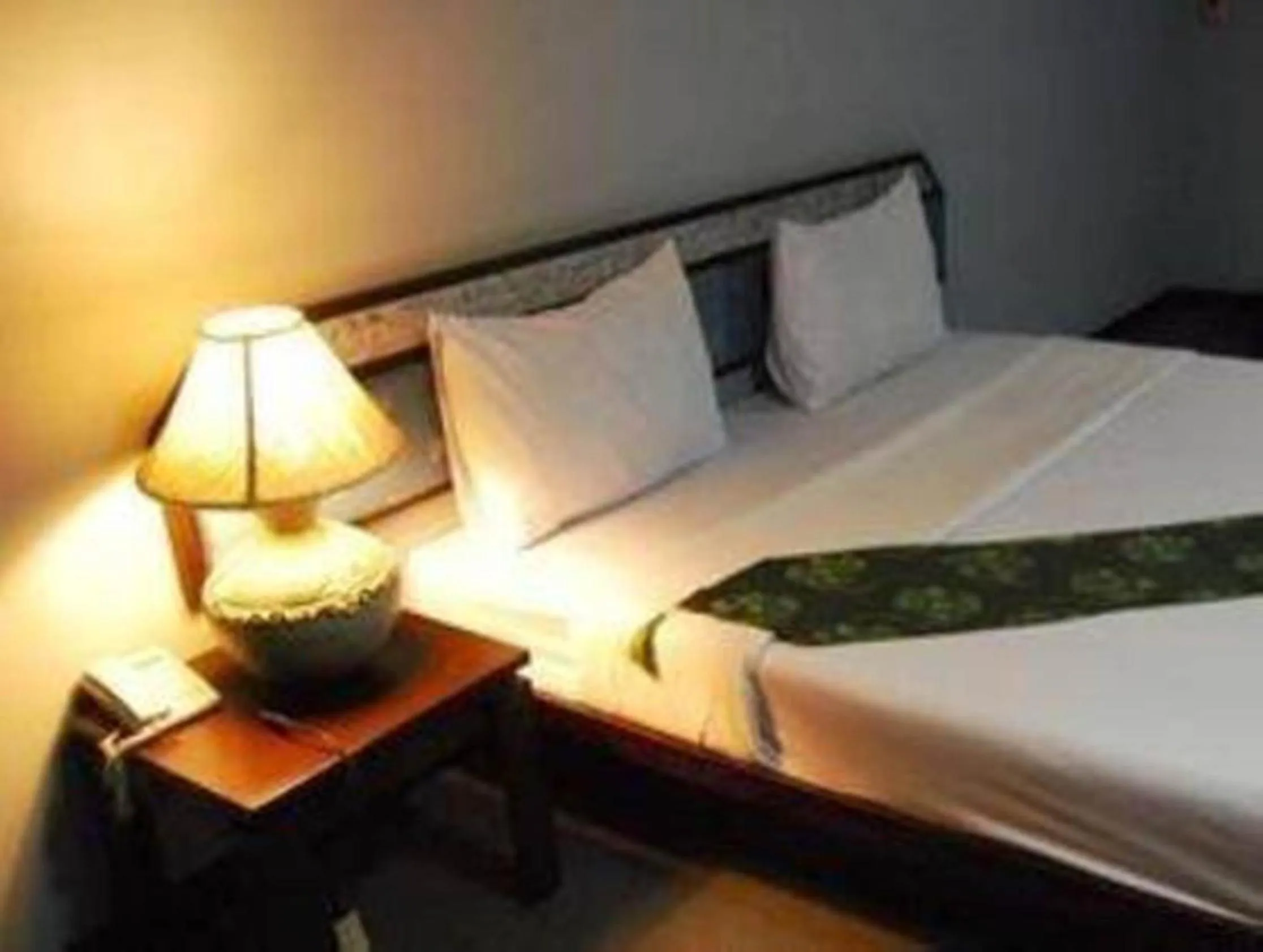 Bed in King Royal Garden Inn