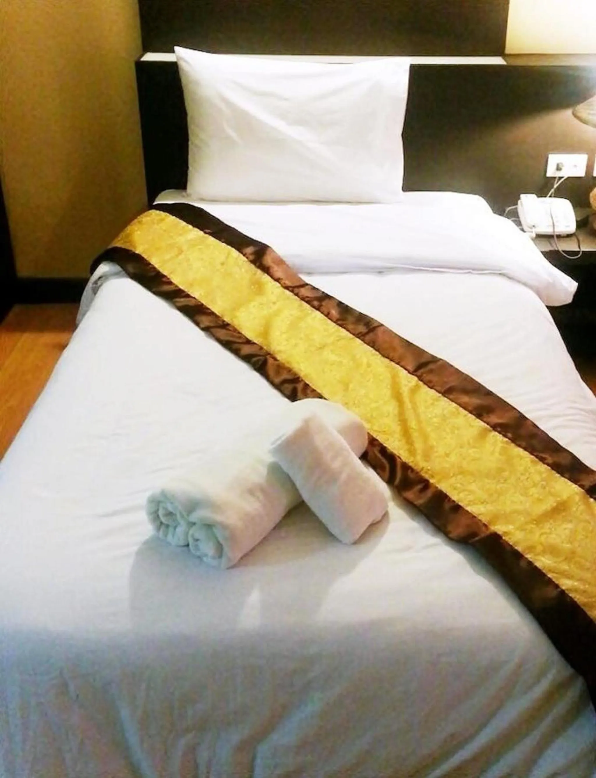 Bed in King Royal Garden Inn