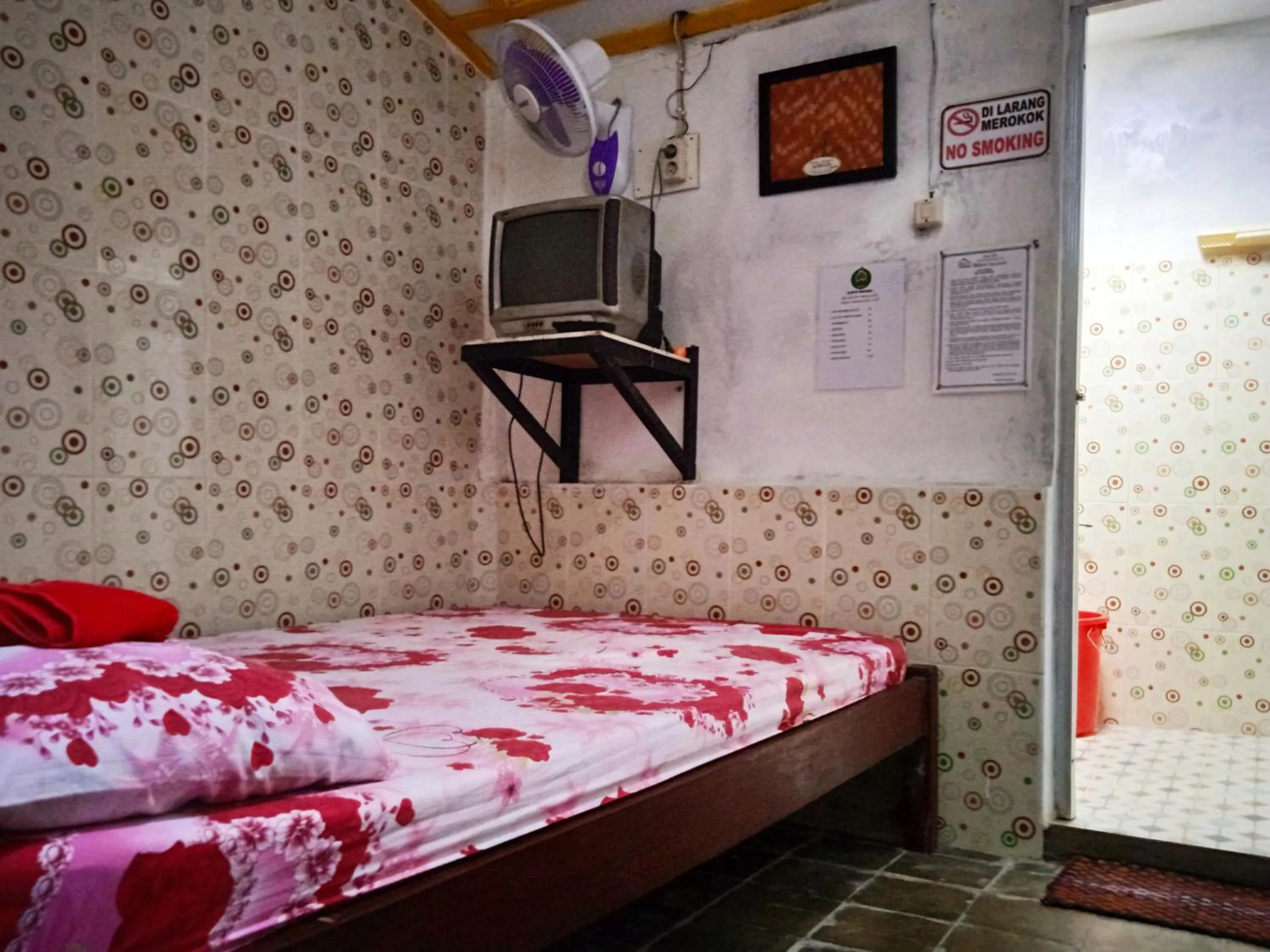 Bed in Homestay Ndalem Soewondo