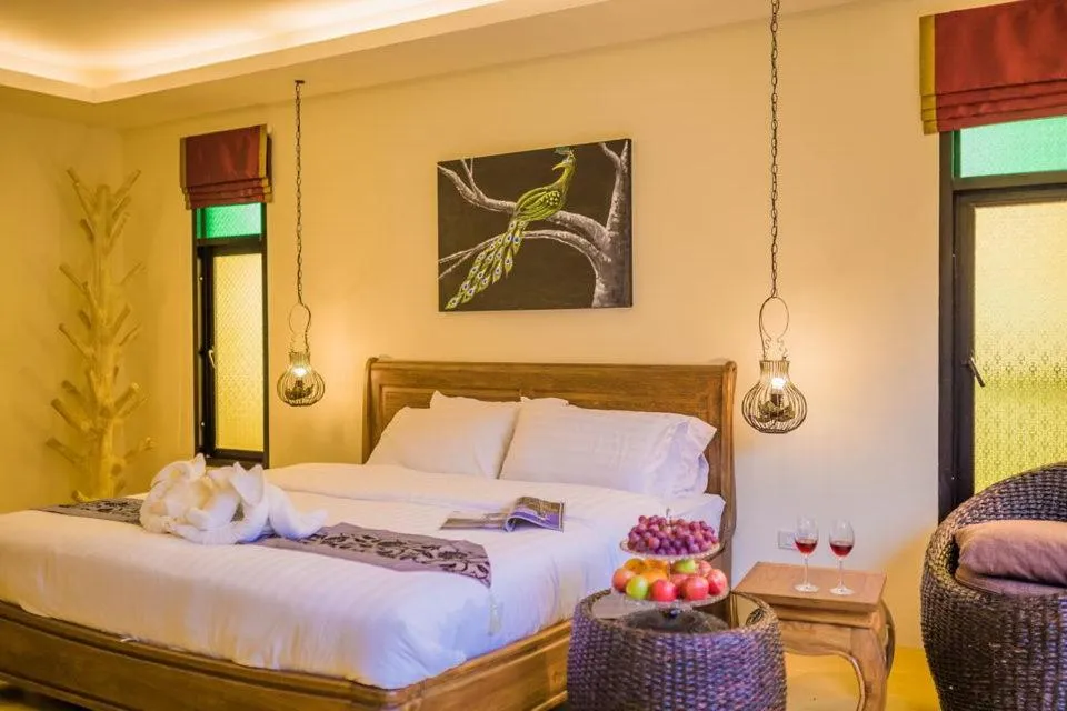 Bed in Pa Prai Villas and Suites Resort