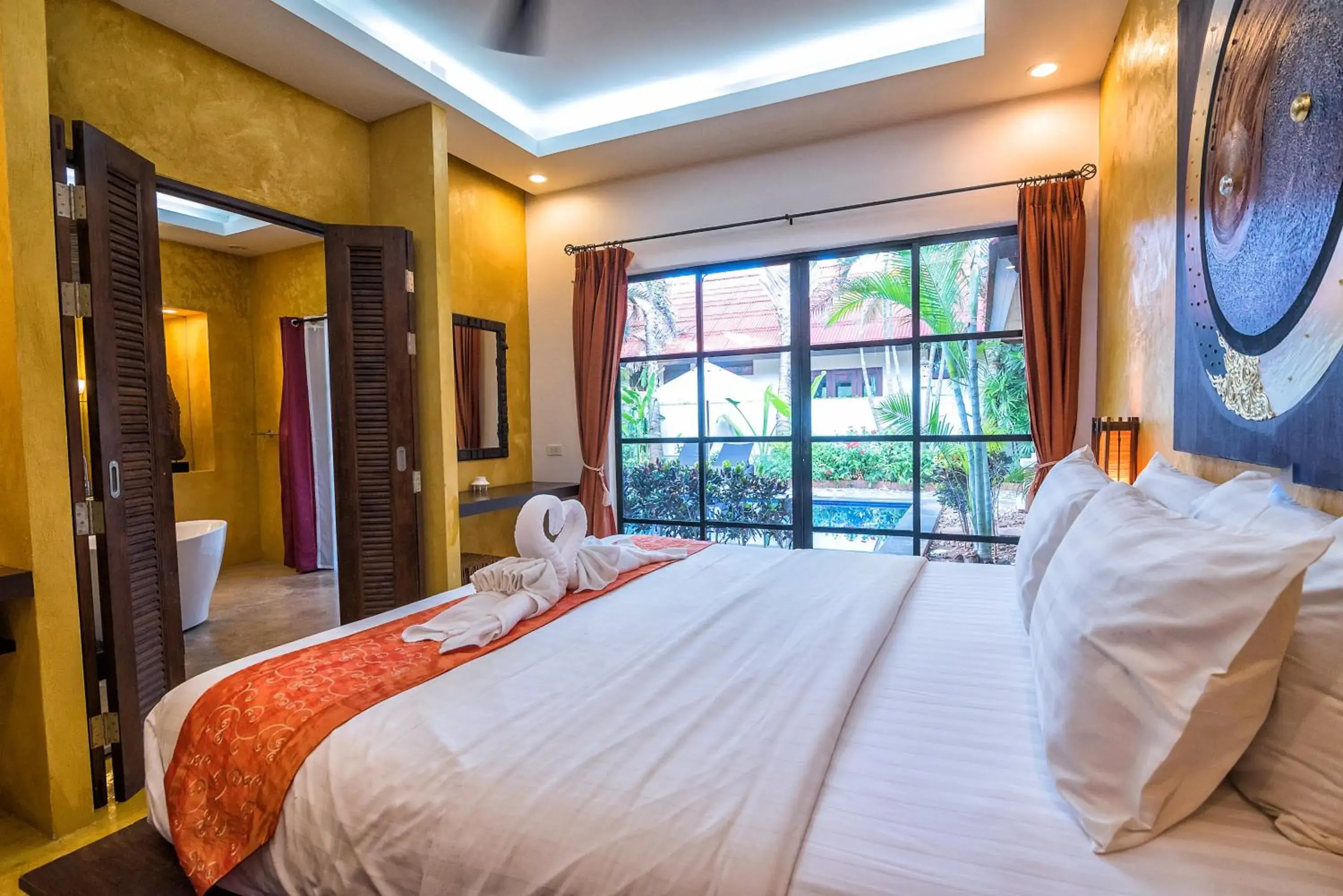 Bed in Pa Prai Villas and Suites Resort Bed in Pa Prai Villas and Suites Resort