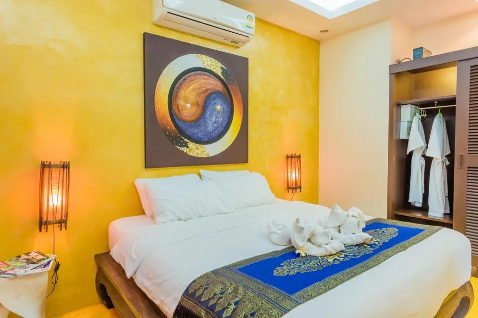 Bed in Pa Prai Villas and Suites Resort