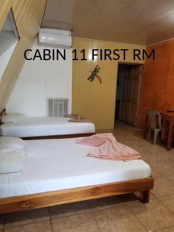 View (from property/room), Bed in Mapi's Cabins