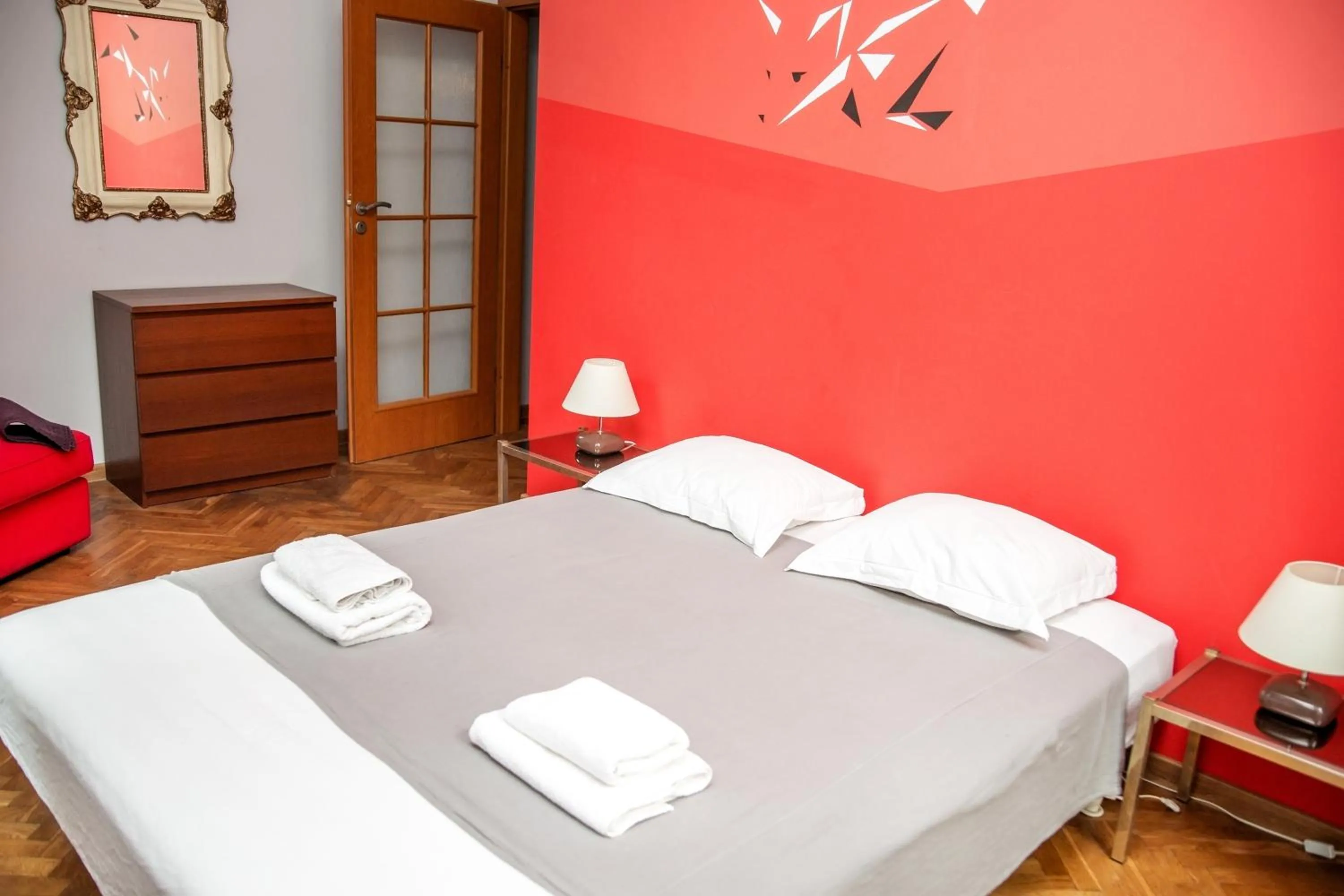 Bed in Red Kurka Apartments