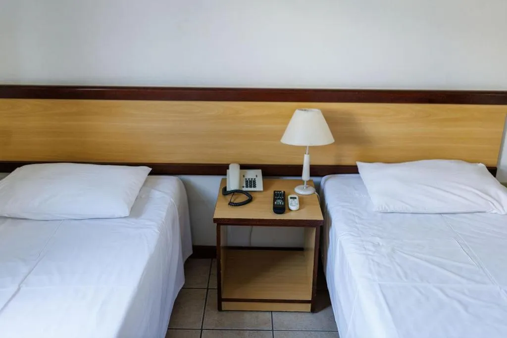 Bed in Solar Flat Hotel