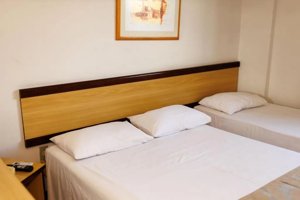 Bed in Solar Flat Hotel