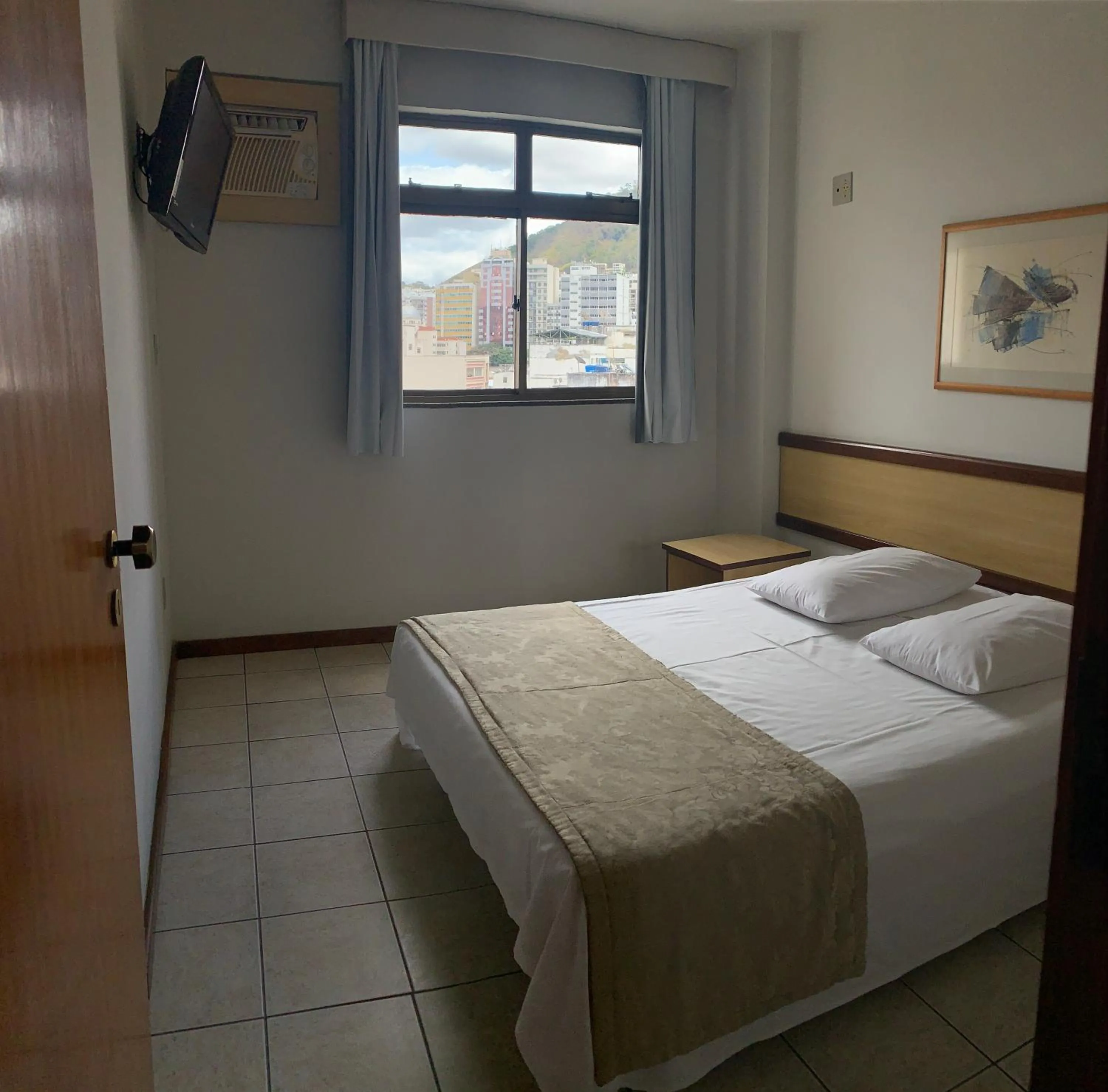 Bed in Solar Flat Hotel