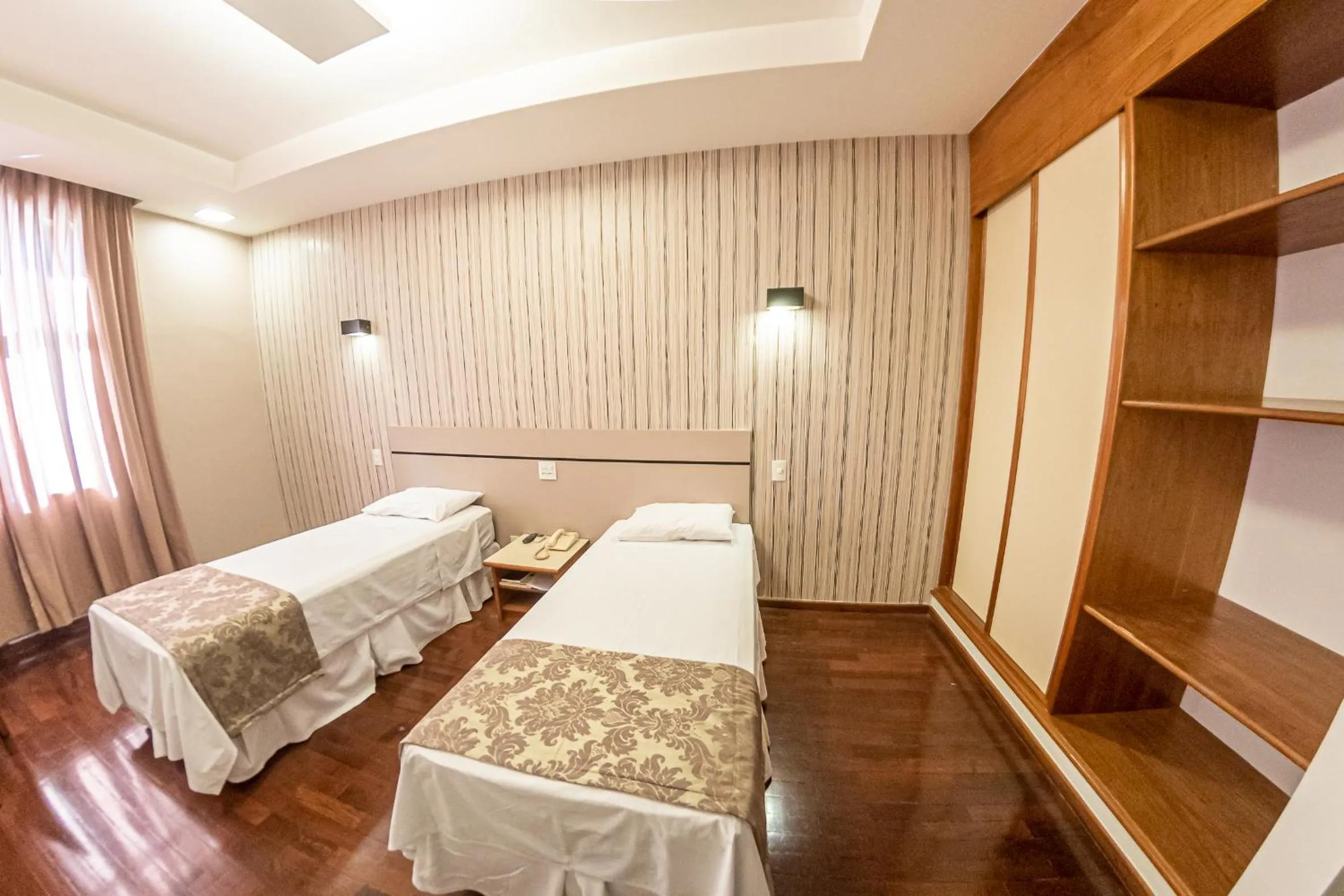 Bed in Serrano Residencial Hotel