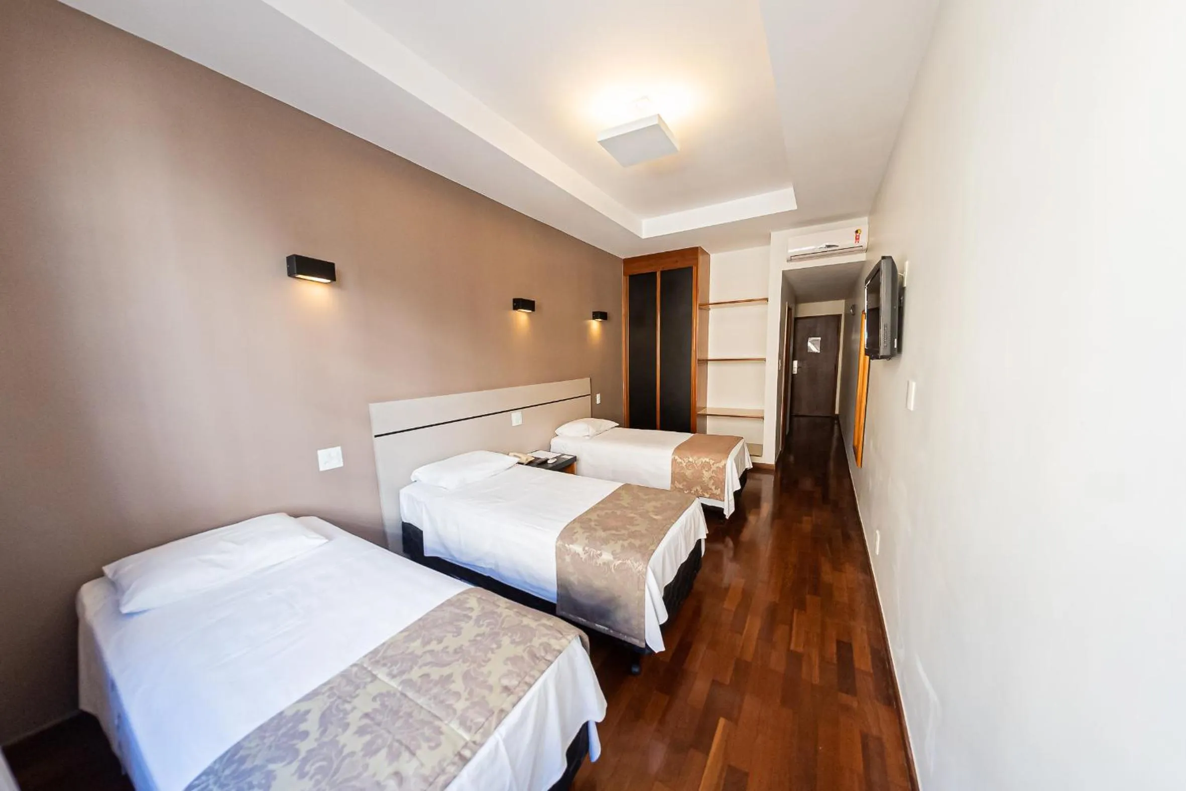 Bed in Serrano Residencial Hotel