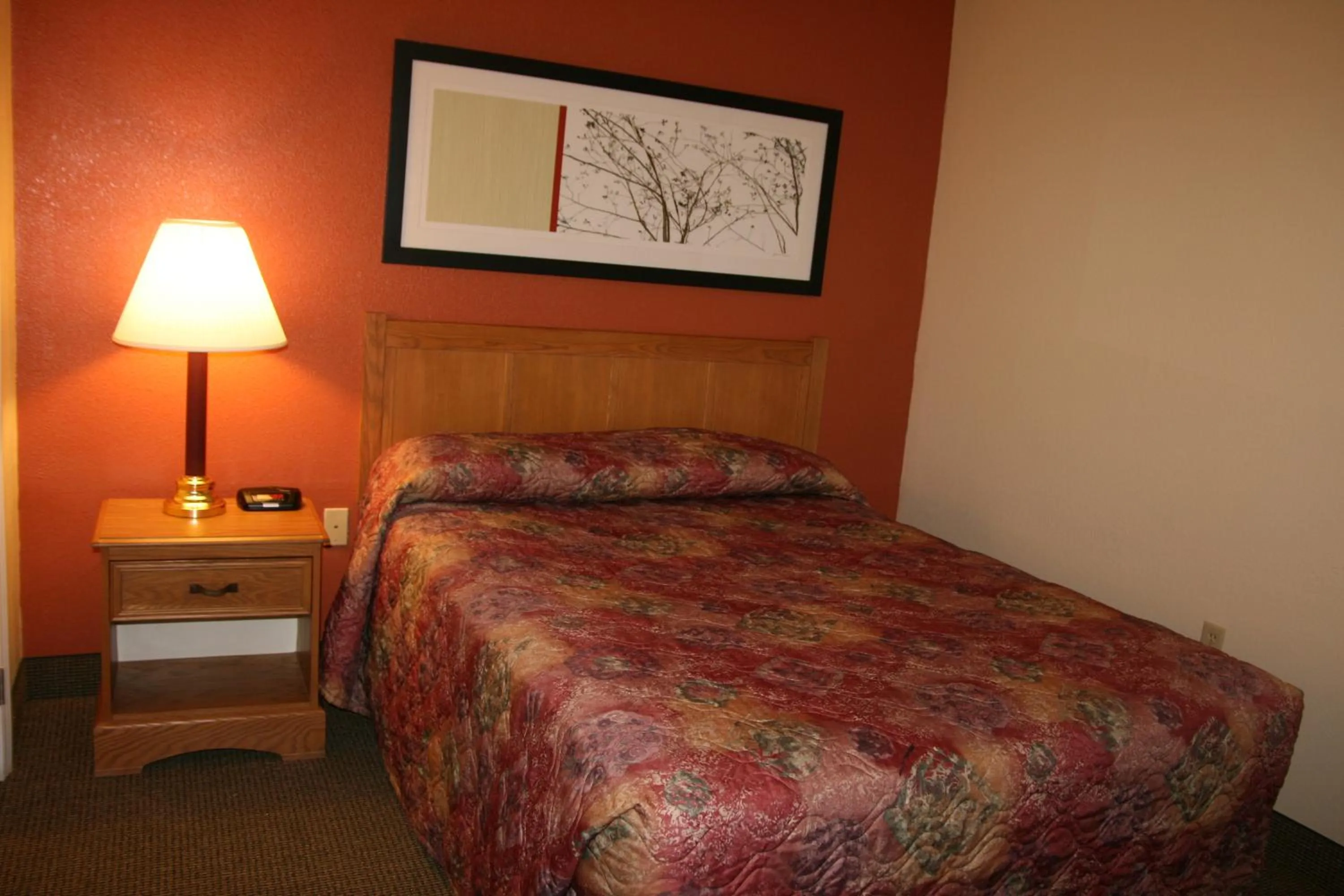 Bed in Affordable Suites Sumter