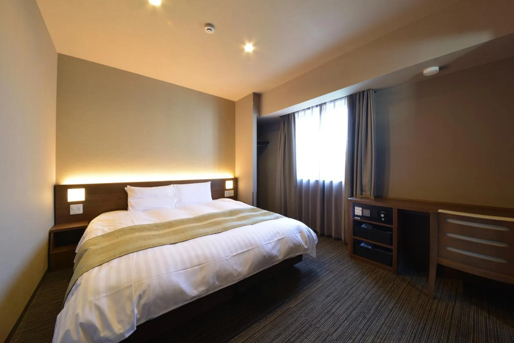 Bed in Dormy Inn Takamatsu Chuo Koenmae Natural Hot Spring