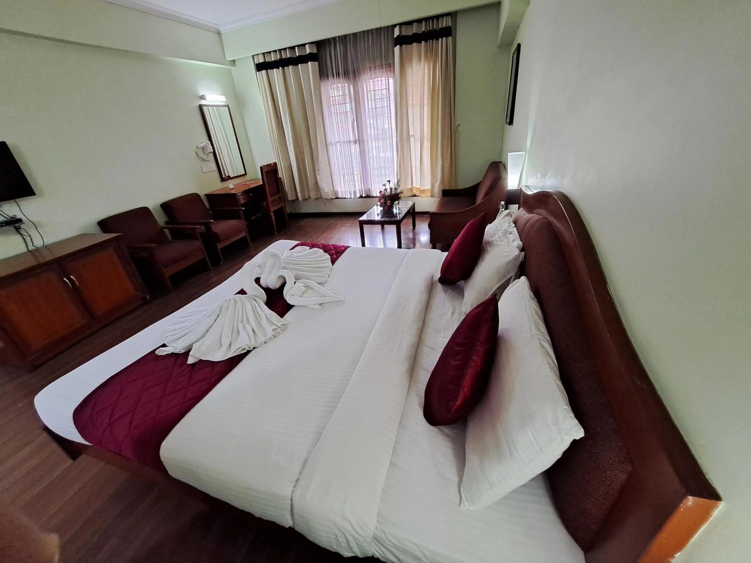 Bed in Hotel Preethi Classic Towers