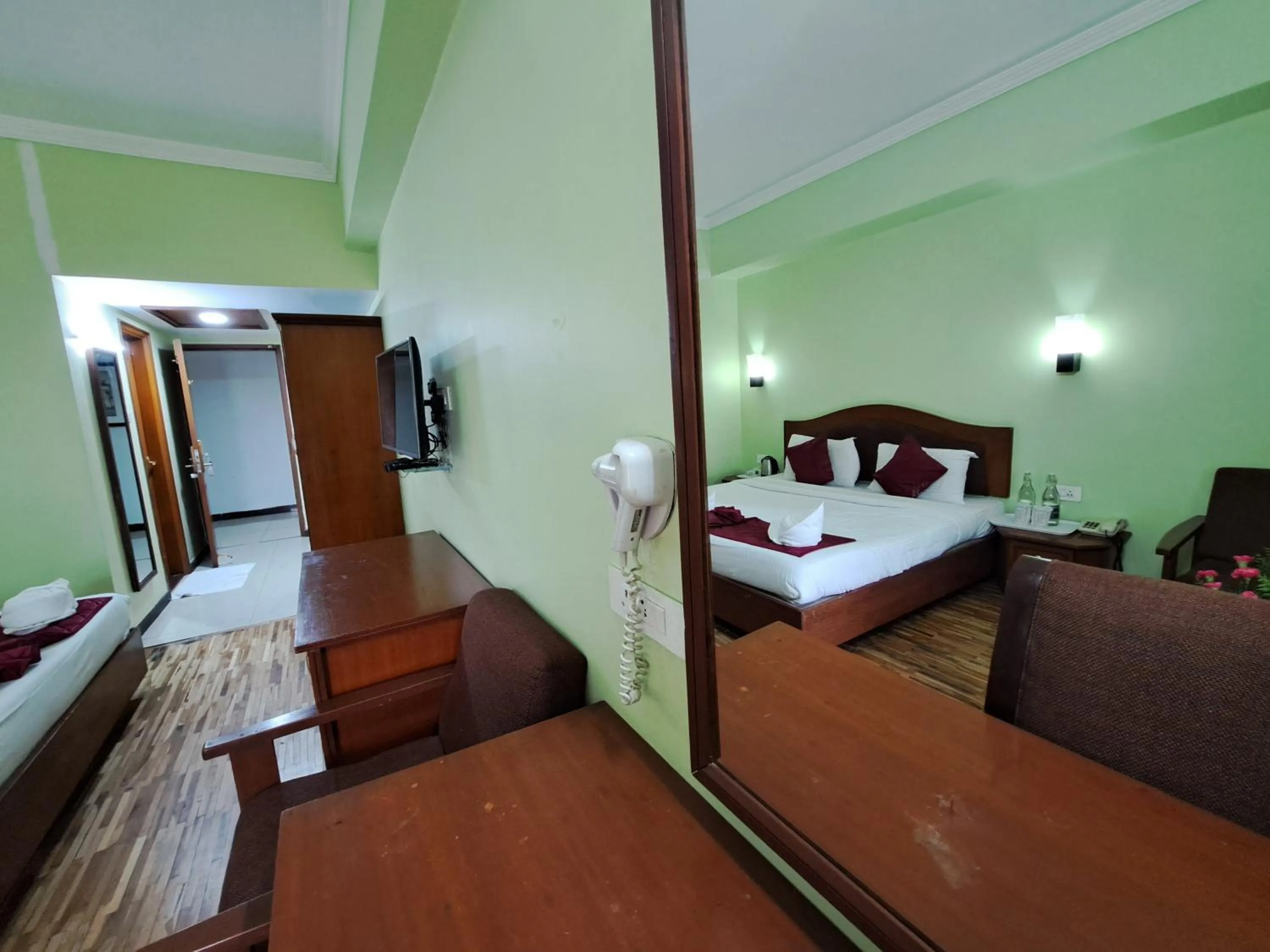Bed in Hotel Preethi Classic Towers