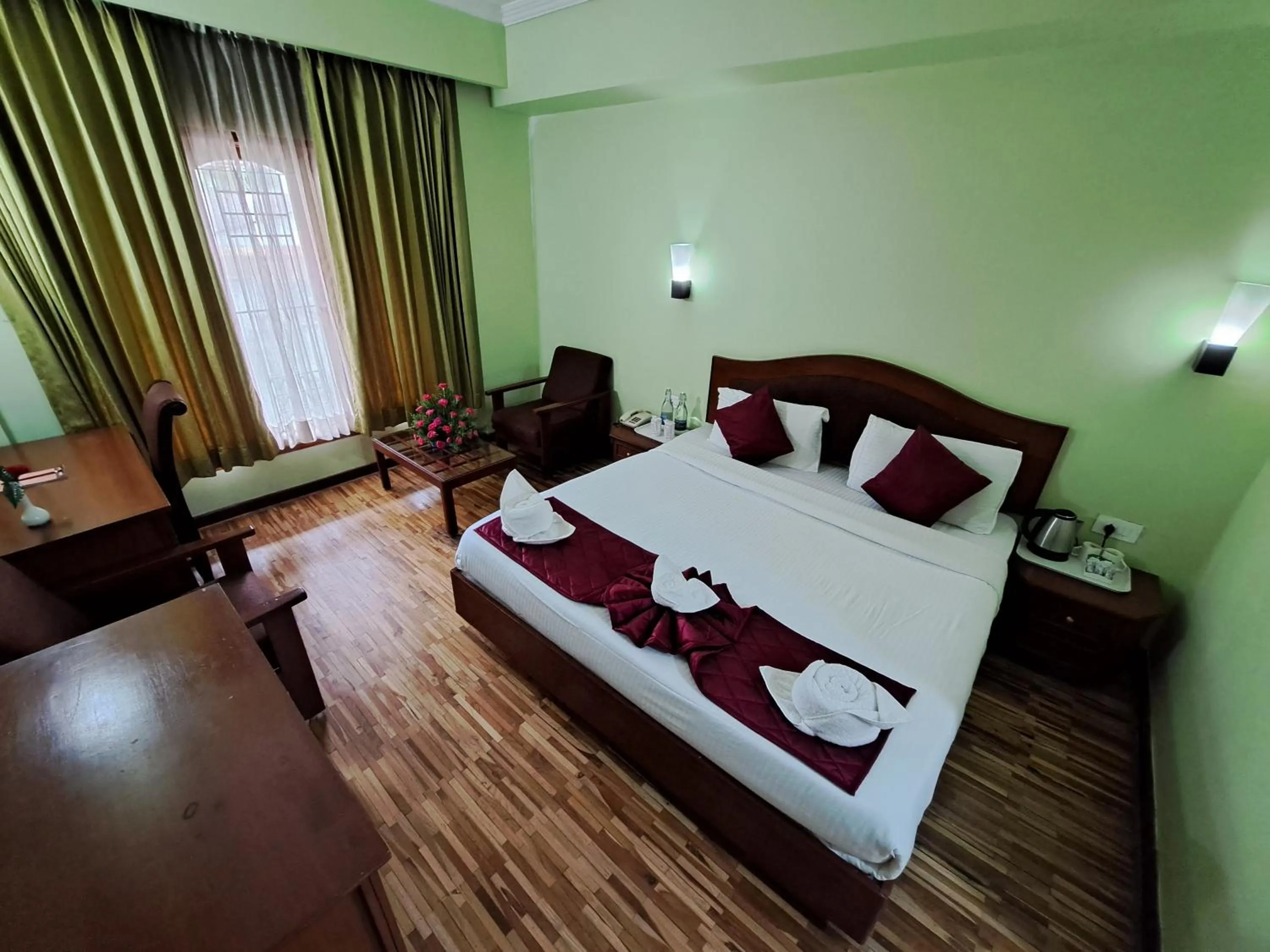 Bed in Hotel Preethi Classic Towers