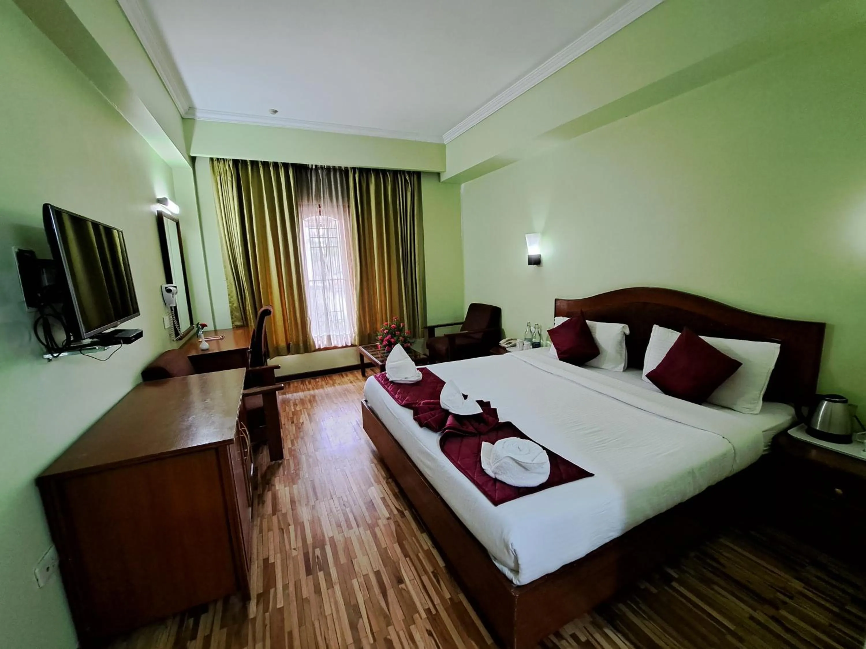 Bed in Hotel Preethi Classic Towers