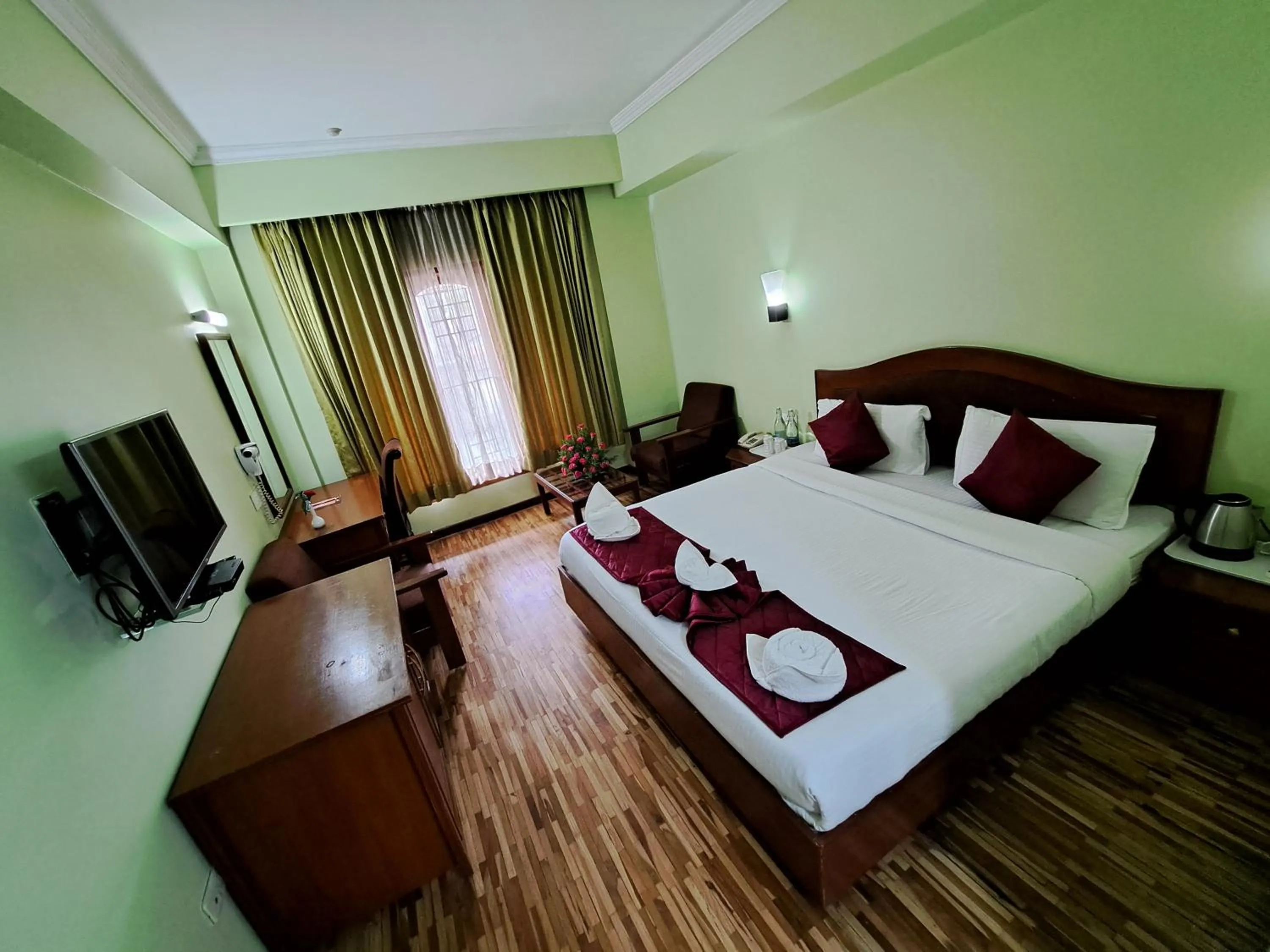 Bed in Hotel Preethi Classic Towers