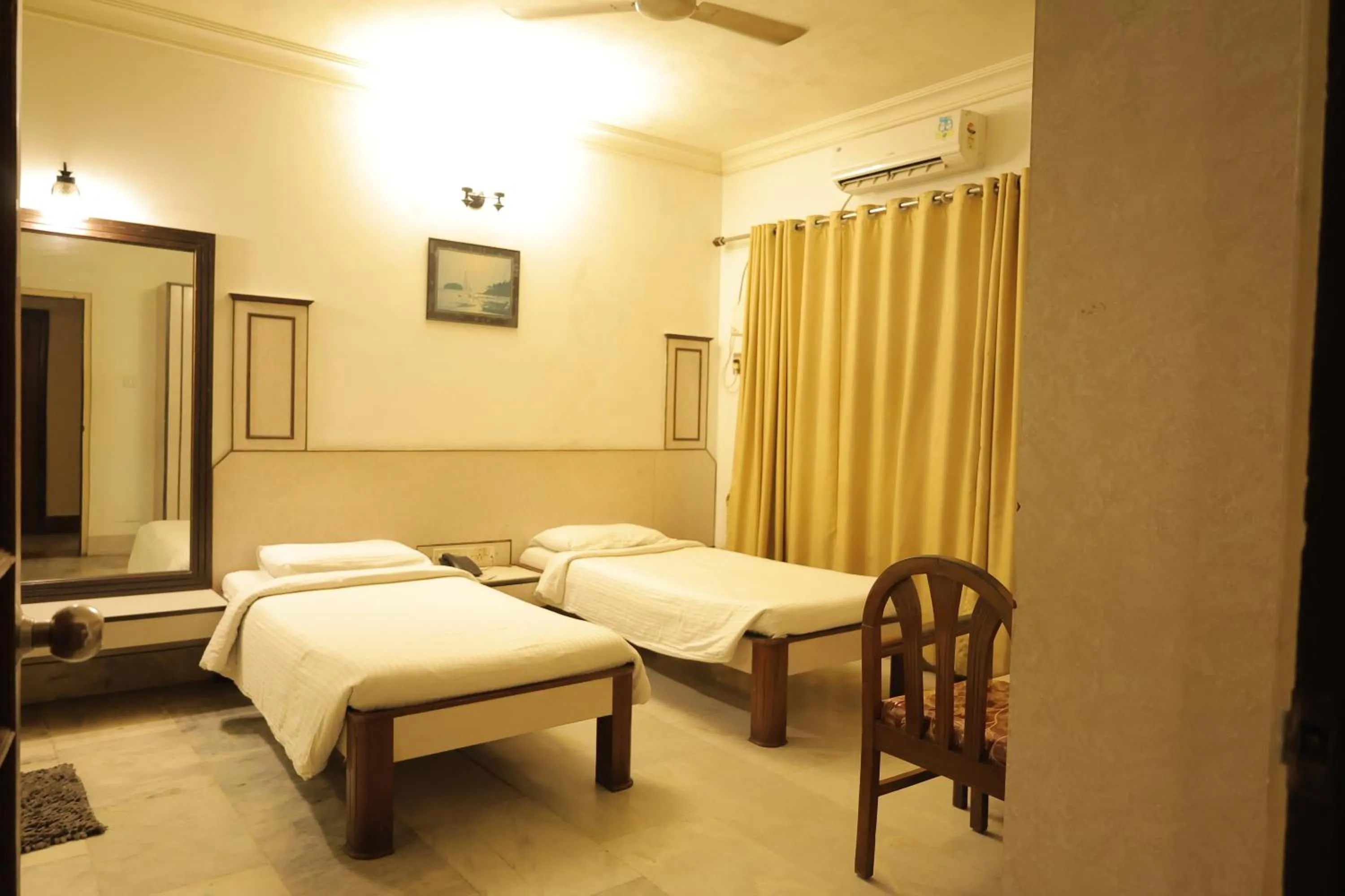 Photo of the whole room, Bed in Hotel Mangalore International