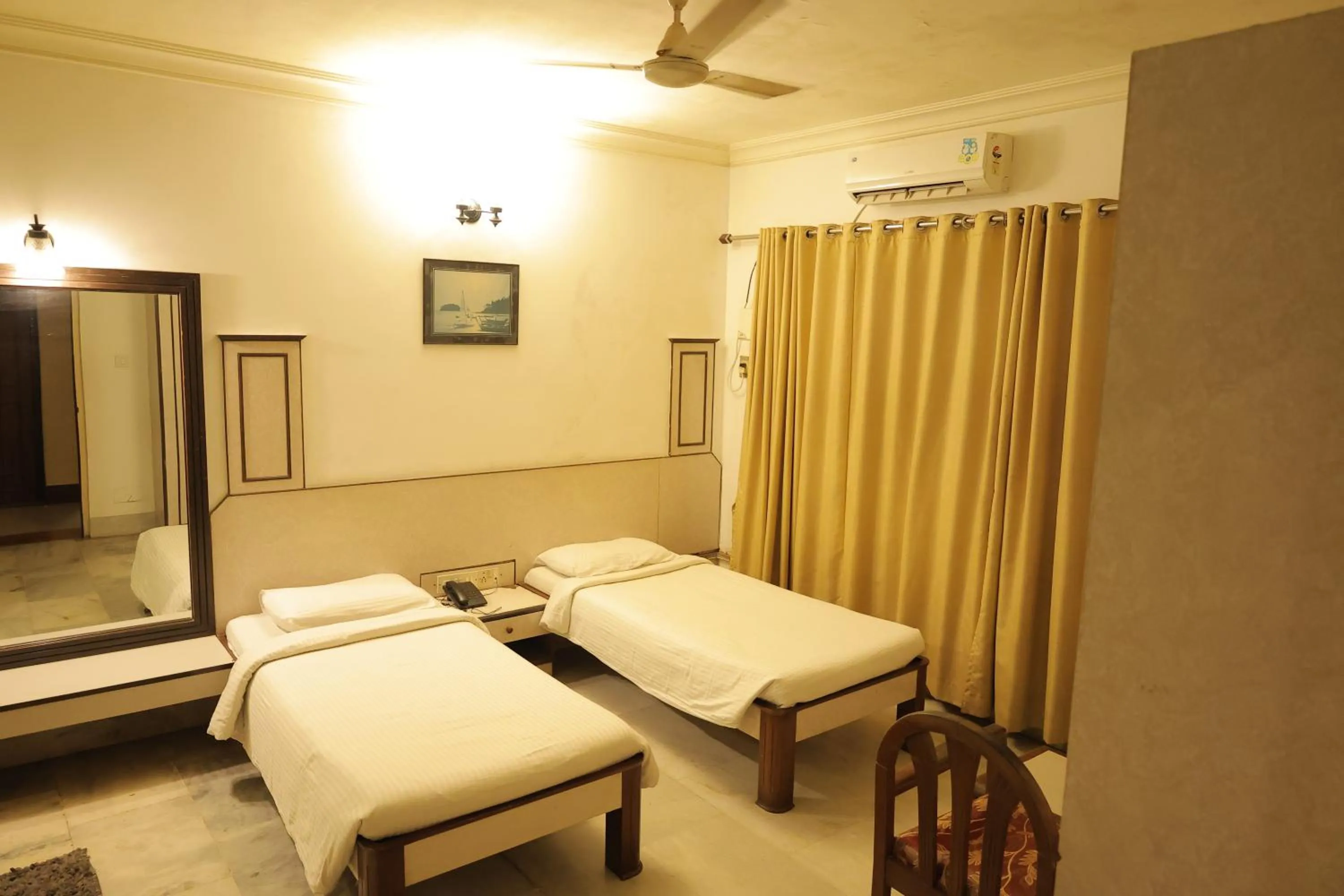 Photo of the whole room, Bed in Hotel Mangalore International