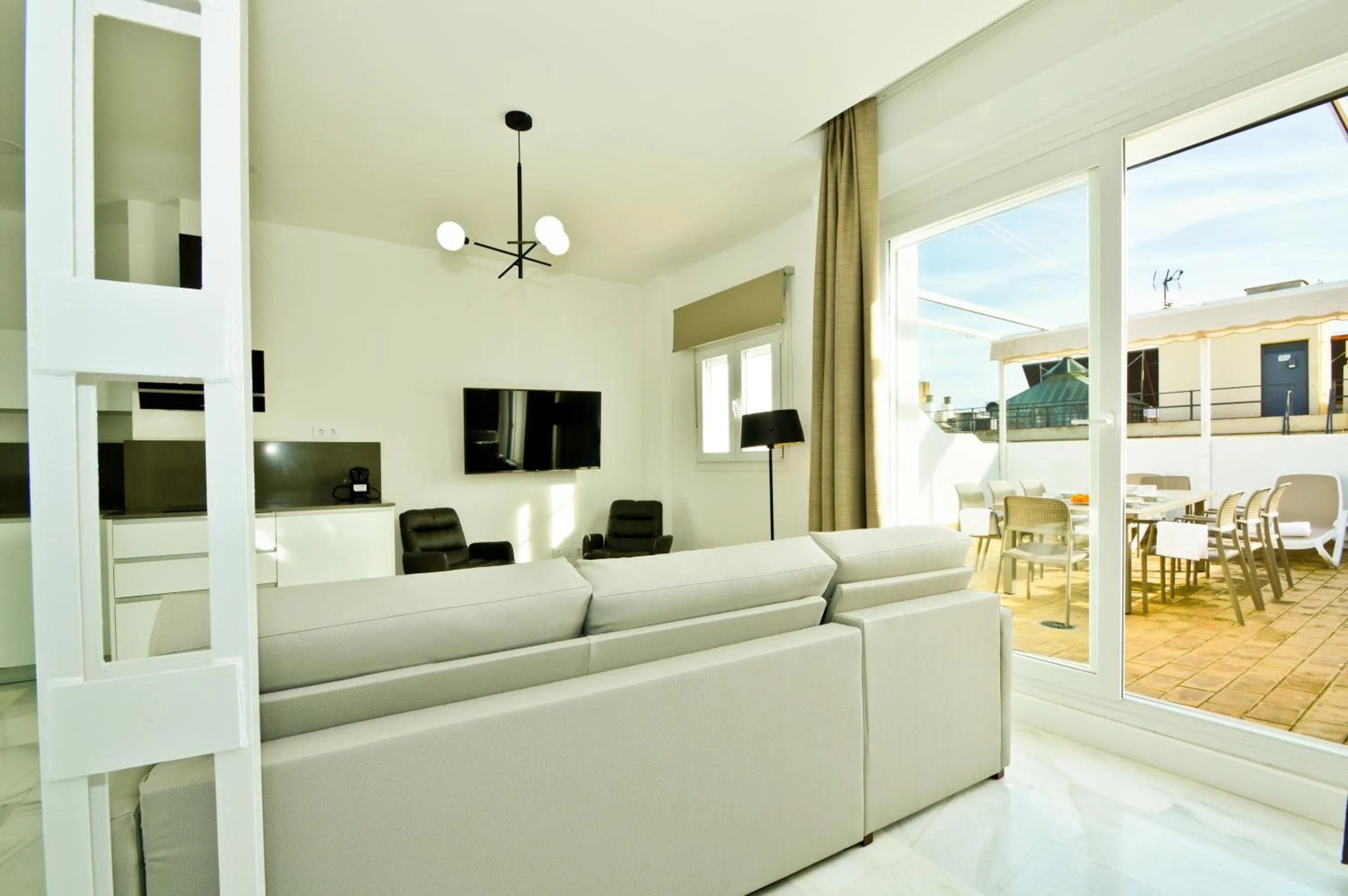 Communal lounge/ TV room in NineSuites