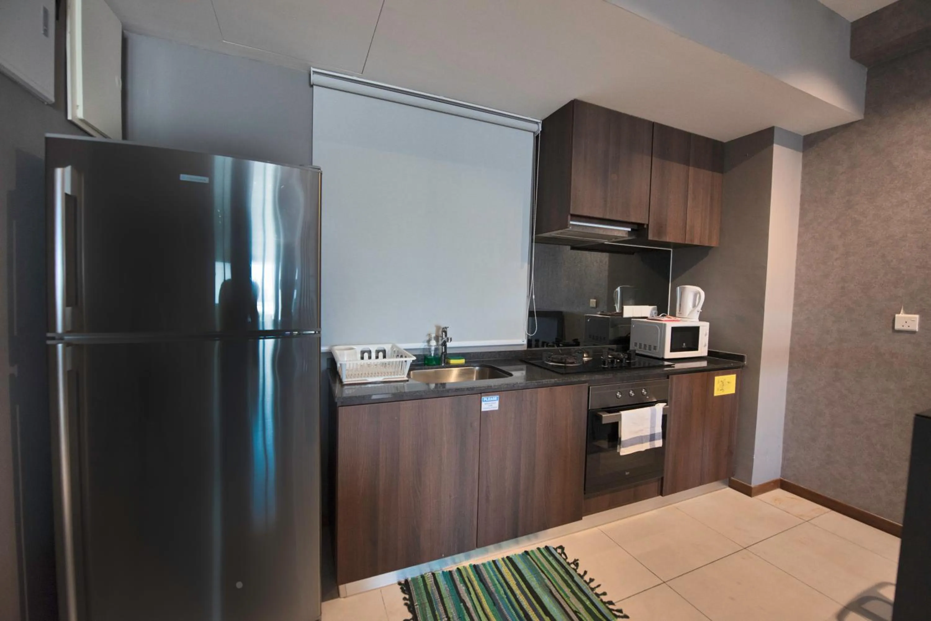 Kitchen or kitchenette in The Landmark by Katana