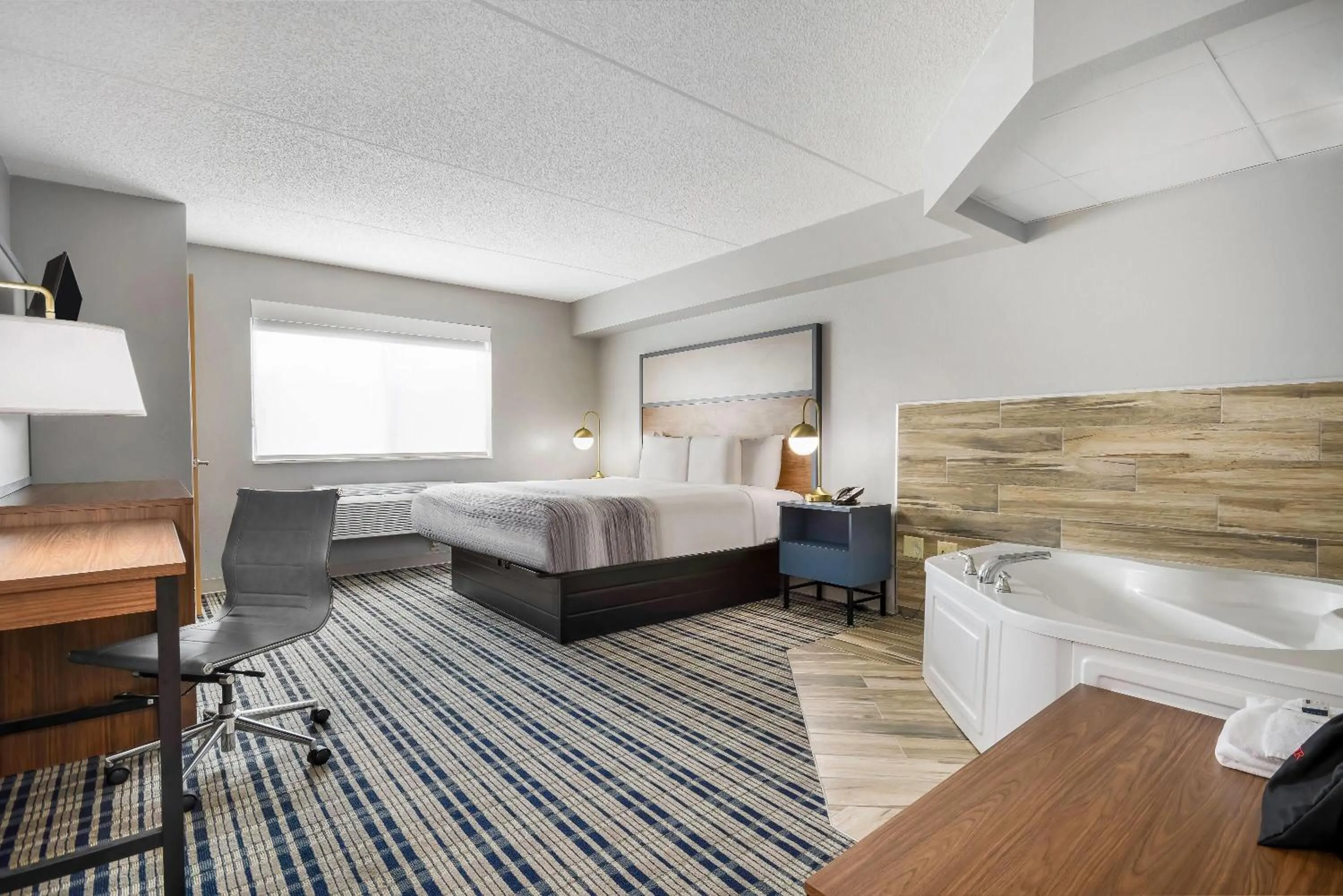 Bed in AmericInn by Wyndham Wausau